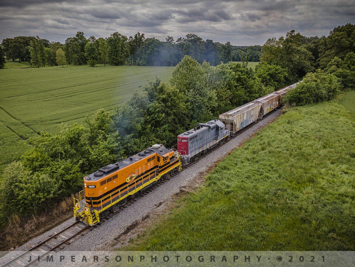 Kentucky-West Tennessee Railway 1809 and 304 depart Dresden, TN

May 10th, 2021 was my first ever day of chasing on this shortline railroad, the Kentucky-West Tennessee (KWT) Railway. Here we find Z978 (KWT 1809 and 304 leading) as it pulls out of the trees just west of Dresden, Tennessee on their run between Dresden and McKenzie, Tennessee under stormy skies.

The KWT is owned by the Genesee & Wyoming Railroad who owns or leases 116 railroads across North America, the United Kingdom and Europe. The KWT Owns or leases 72 miles of track between Kentucky and Tennessee and interchanges with the CSX at Bruceton, TN. It was bought by the Genesee & Wyoming Railroad in 2005.

Tech Info: DJI Mavic Air 2 Drone, RAW, 4.5mm (24mm equivalent lens) f/2.8, 1/400, ISO 100.