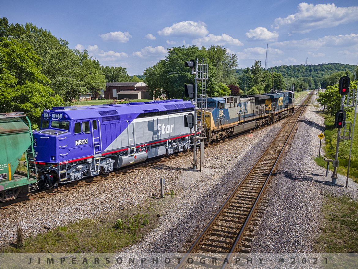 Freshly painted Music City Star Southbound at Mortons Junction, Mortons Gap, Ky

Music City Star NRTX 121 (Ex Amtrak F40PH 121) trails on CSX Q513-22 as it passes through Mortons Junction at Mortons Gap, Ky on its way back south to Nashville, Tennessee, on the Henderson Subdivision, sporting a fresh coat of paint on May 23, 2021. 

According to Wikipedia: The Music City Star is a commuter rail service running between Nashville and Lebanon, Tennessee. The service uses the existing track of the Nashville and Eastern Railroad. The line stops at seven stations: Riverfront, Donelson, Hermitage, Mt. Juliet, Martha, Hamilton Springs, and Lebanon. The operation covers 32 miles of rail line. Service began on September 18, 2006 and is owned by the Tennessee Department of Transportation.

Tech Info: DJI Mavic Air 2 Drone, RAW, 4.5mm (24mm equivalent lens) f/2.8, 1/640, ISO 100.