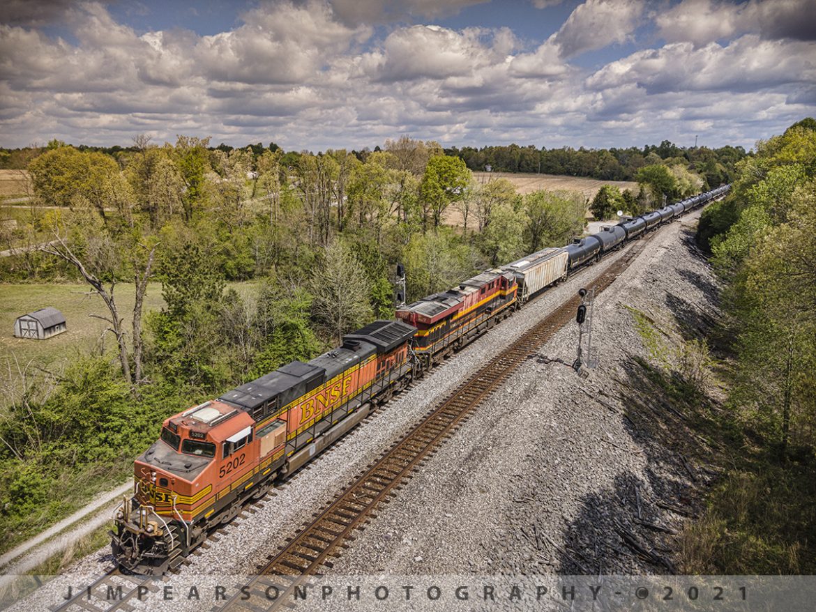 CSX K443 southbound at Kelly, Kentucky on the Henderson Subdivision

BNSF 5202 and KCS 4677 lead CSX K443, a loaded ethanol train, southbound past the north end of Kelly Siding on the Henderson Subdivision at Kelly, Ky on April 22nd, 2021.

I tried catching this train at the south end of Slaughters, Hanson and at Nortonville, but ended up arriving at each of my spots as the train was passing through them! It seemed like every traffic light was red and every car that drove 10mph under the speed limit was between me and my next spot!! It happens sometimes and while I didnt get the shots I wanted at each of those locations, I did at several others such as this one at Kelly! Sometimes you must be persistent in your pursuit of photos! 

Tech Info: DJI Mavic Air 2 Drone, RAW, 4.5mm (24mm equivalent lens) f/2.8, 1/640, ISO 100.