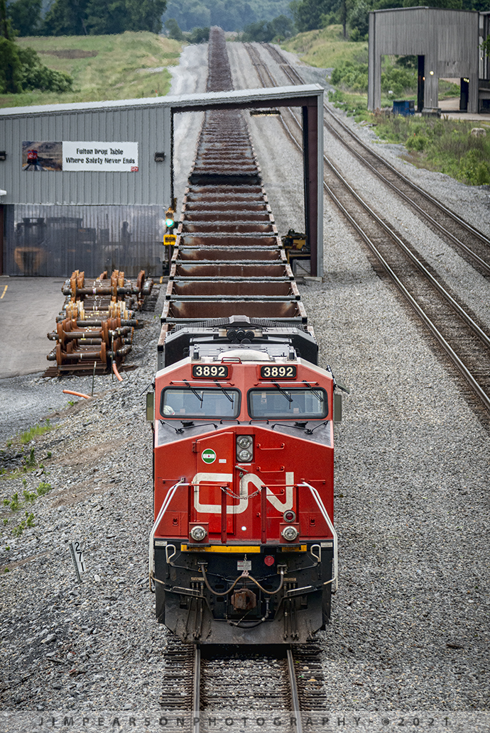 Fulton CN Drop Table facility, South Fulton, TN

Canadian National DPU 3892 brings up the rear of an empty coal train as it sits at the Fulton Drop Table facility in South Fulton, TN on CNs Fulton Subdivision on May 29th, 2021. CN built the facility several years ago, just off of KY 215, and it allows for the quick change of wheels on train cars, without having to separate the cars from the rest of the train.

Tech Info: Nikon D800, RAW, Sigma 150-600 @ 300mm, f/7.6, 1/1000, ISO 1000.