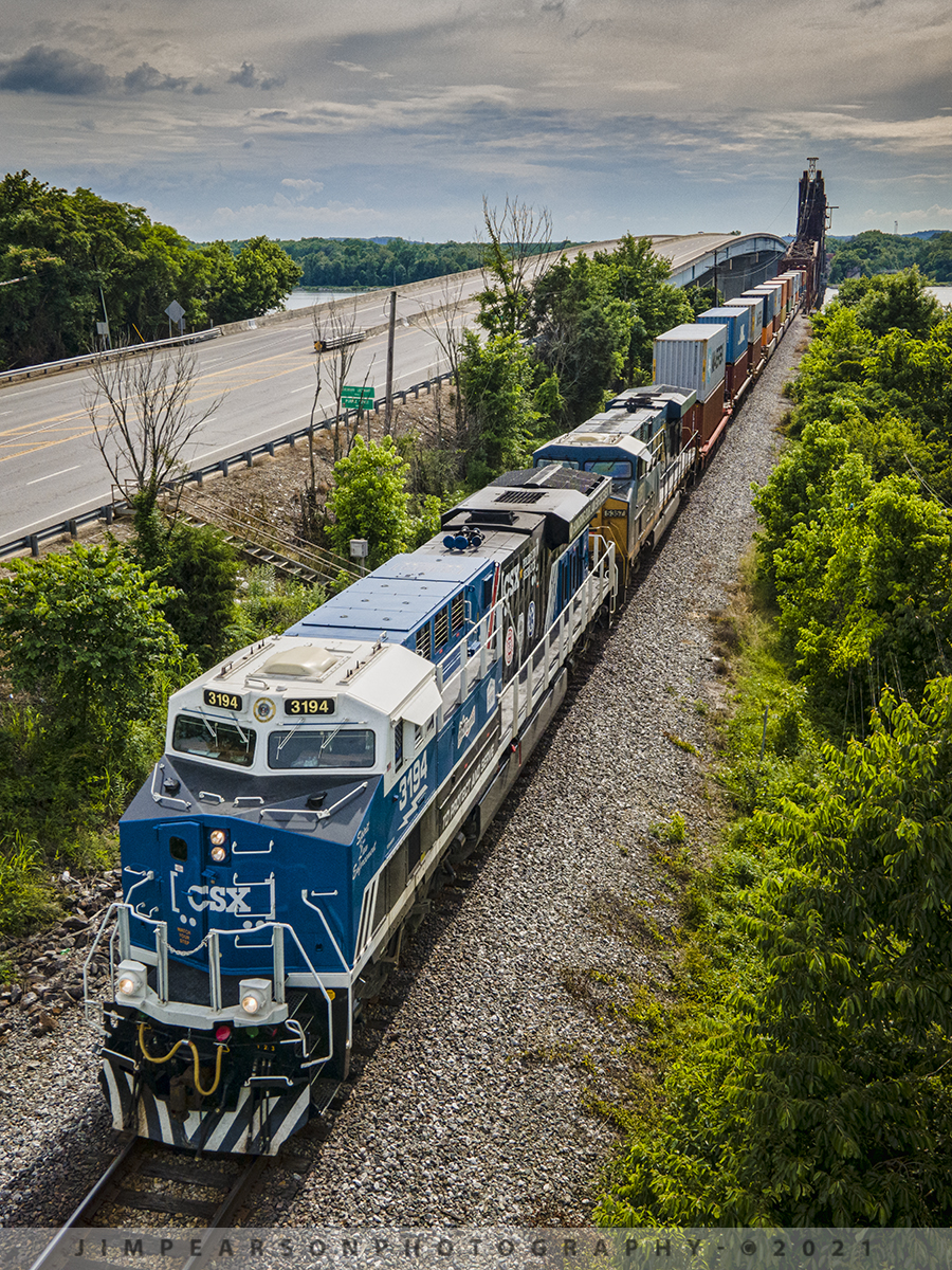 CSXT 3194 Spirit of our Law Enforcement unit eastbound at New Johnsonville, TN

Not the shot I had originally planned for this location of CSXT 3194 (Spirit of our Law Enforcement) unit leading CSX Q125 east across the Tennessee River, but a good alternate shot, none the less!

My primary spot for this location was going to be up close to the drawbridge with the train coming across, but when I flew down to the location, I realized the battery on the drone was at 52 percent. 

I left the drone in place till the battery dropped to 28% and flew it back to me to change it (didnt want it to drop from the sky into the river). Not sure at the time why it was so low as I keep all the batteries on charge with an inverter in my SUV, but when I checked the inverter had come unplugged and all three batteries were less than 50% charged, I put the next strongest battery in (48%) and went airborne in time to see the train coming down the throat of the bridge! 

Even in sport mode I knew I wouldnt make it back to my spot and so I set up for this secondary spot for this shot I knew I was going to crop as a vertical image. From now on Ill always remember to make sure the charger is connected before I hit the road!

According to CSX Press Releases - CSX Transportation's "Spirit of our Law Enforcement" commemorative locomotive CSXT 3194 was renamed and painted to honor our nation's police officers who dedicate their lives to serve and protect communities across our network.

Tech Info: DJI Mavic Air 2 Drone, RAW, 4.5mm (24mm equivalent lens) f/2.8, 1/640, ISO 100.