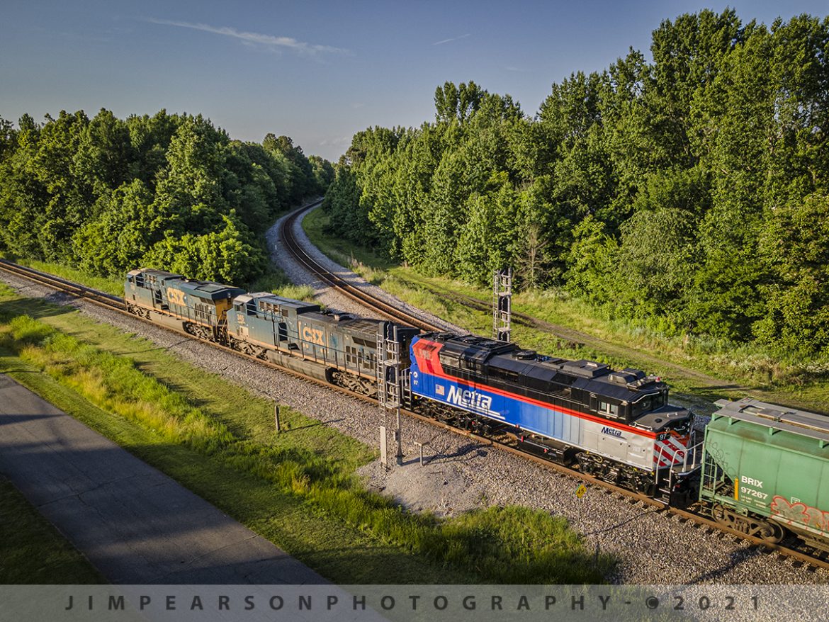 Northbound CSX 648 with Metra #97 trailing at Mortons Gap, Ky

The late afternoon sunlight rakes across the landscape a newly refurbished Metra passenger engine #97 trails behind CSXT 749 and 345 on CSX Q648 as it heads north through Mortons Junction on the CSX Henderson Subdivision at Mortons Gap, Ky on June 14th, 2021.

One of the many things I enjoy about railfanning the Henderson Subdivision is all interesting and unusual moves we get through here, such as this Metra unit. The subdivision currently sees about 20-30 trains a day, with foreign power mixed in, such as CP, CN, rebuilds, BNSF, KCS and from time to time even NS.

According to Wikipedia: Metra (reporting mark METX) is a commuter rail system in the Chicago metropolitan area serving the city of Chicago and surrounding suburbs via the Union Pacific and BNSF Railways. The system operates 242 stations on 11 rail lines. It is the fourth busiest commuter rail system in the United States by ridership and the largest and busiest commuter rail system outside the New York City metropolitan area.

Tech Info: DJI Mavic Air 2 Drone, RAW, 4.5mm (24mm equivalent lens) f/2.8, 1/320, ISO 100.