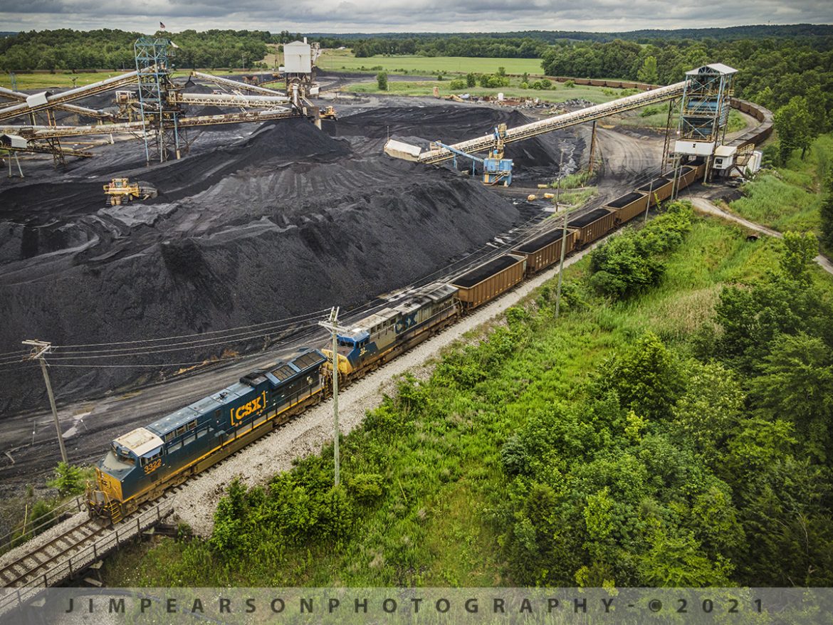 CSX J801-06 loads at Warrior Coal Mine Loop, Nebo, Kentucky

CSXT 3322 and 322 lead as CSX J801-06 creeps along as it starts to load at the Warrior Coal mine loop, just outside of Nebo, Kentucky on June 7th, 2021 under stormy skies. This train comes out of CSX Atkinson Yard in Madisonville, Ky where it will return to after loading and be combined with another loaded coal train of similar length before heading south on the Henderson Subdivision.

Tech Info: DJI Mavic Air 2 Drone, RAW, 4.5mm (24mm equivalent lens) f/2.8, 1/320, ISO 100.