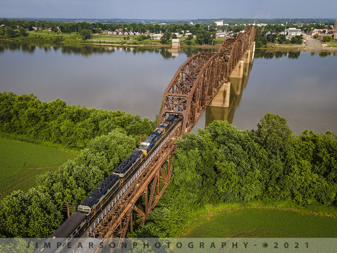 CST P001 heading over the Ohio River Bridge at Henderson, KY

The nice evening light on the Henderson Subdivision bathes the scene as the CSX Presidents Passenger train P001 starts its run across the Ohio River Bridge at Henderson, KY. CSX GEVO units 3310, 3271 leads with CSXT 1 & 2 trailing as they pull 11 cars at a little over 1,000 ft long. CSX had problems with PTC on CSXT 1 & 2 and thats why they GEVOS led the train on June 10th, 2021.

CSX has repainted two of its F40PH locomotives, to be used on this business train, into predecessor Baltimore & Ohio's blue, gray, and black paint scheme. CSX1 is former 9998 (former Amtrak 288) and from what I can find out CSXT 2 is the former F40PH 9993 (former Amtrak 395). The other F40s are expected to be painted in the same scheme in the coming months as they are cycled through the shops.

Tech Info: DJI Mavic Air 2 Drone, RAW, 4.5mm (24mm equivalent lens) f/2.8, 1/500, ISO 100.