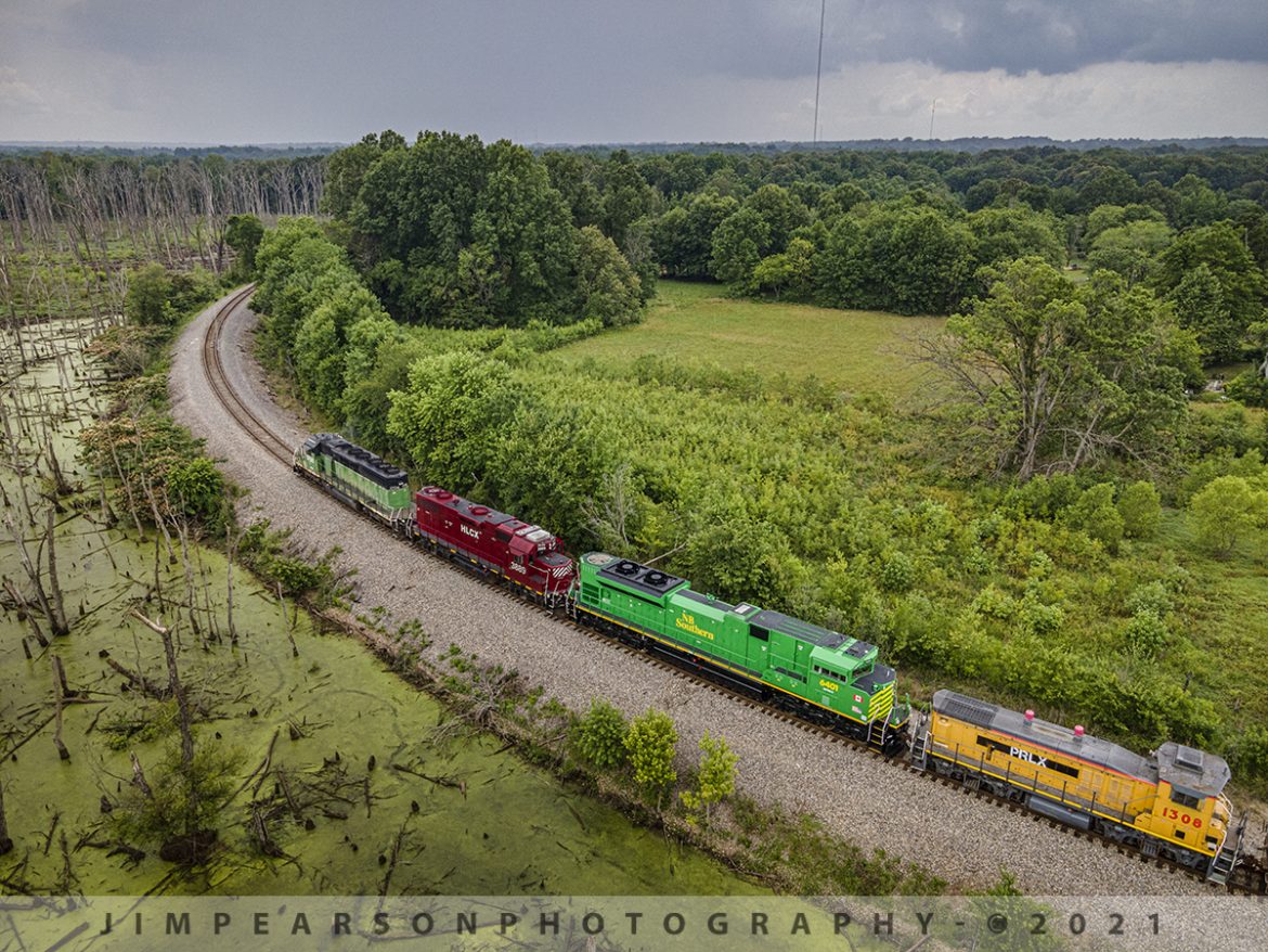 New Brunswick Southern Railway 6401 rounds the horn at Paducah, Ky

Newly refurbished New Brunswick Southern Railway (NBSR) 6401 trails as the third unit on the northbound Paducah to Centralia, IL BNSF local as it heads up the grade through what's referred to as "The Horn" because of its shape where they depart the Paducah and Louisville Railway (PAL) yard at Paducah, Ky on June 30th, 2021, with PRLX switcher 1308 trailing behind it and BNSF 1706 and HCLX 3889 leading. 

Due to the length and weight of their train today they stalled on the grade leading up to the flyover at the PAL and had to do a reverse move and get another run at it from CNs P&I Junction, before getting up the grade to the flyover. That's the photo I posted yesterday and is here on my page if you missed it.

Locomotive 6401 is the first of six units that are being refurbished by Progress Rail for NBSR out of Saint John, NB, Canada. The other units are 6402-6406 and they are all SD70M-2 units from what I understand. The other two units in the consist were BN 1706 leading (more photos to come on this unit) and HLCX 3889.

According to Wikipedia: The New Brunswick Southern Railway Company Limited (reporting mark NBSR) is a 131.7 mi (212.0 km) Canadian short line railway owned by the New Brunswick Railway Company Limited, a holding company that is part of "Irving Transportation Services", a division within the industrial conglomerate J.D. Irving Limited.

Tech Info for each image is in that images caption: DJI Mavic Air 2 Drone, RAW, 4.5mm (24mm equivalent lens) f/2.8, 1/400, ISO 100.
