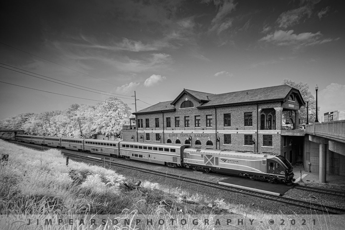 Amtrak 393 pulls into the old Illinois Central Depot in downtown Mattoon, Illinois

Amtrak 393 (The Illini) pulls into the old Illinois Central (IC) Depot in downtown Mattoon, Illinois with 4623 leading the Wednesday evening southbound train from Chicago to Carbondale, Illinois bathed in Infrared light on the CN Champaign Subdivision.

According to Wikipedia, The Mattoon station is housed in the former Illinois Central Railroad Depot. The depot was completed in 1918 and placed on the National Register of Historic Places in 2001. At its height, the building housed a power plant, mail room, luggage room, and restaurant, in addition to the main hall where passengers waited to board trains. As many as ten trains a day departed the depot in the 1950s.

During 2010, a $3 million restoration project, paid for from a mix of private, state, and federal funding, was undertaken, replacing paint, flooring, and other interior fixtures.

The station currently serves as a stop for the Illini, Saluki, and City of New Orleans passenger trains. The tracks themselves, formerly part of the Illinois Central Railroad, are now owned by the Canadian National Railway (CN). Freight trains run by CN pass through frequently.

Tech Info: Fuji XT-1, RAW, Converted to 720nm B&W IR, Irex 11mm, f/4, 1/250, ISO 400