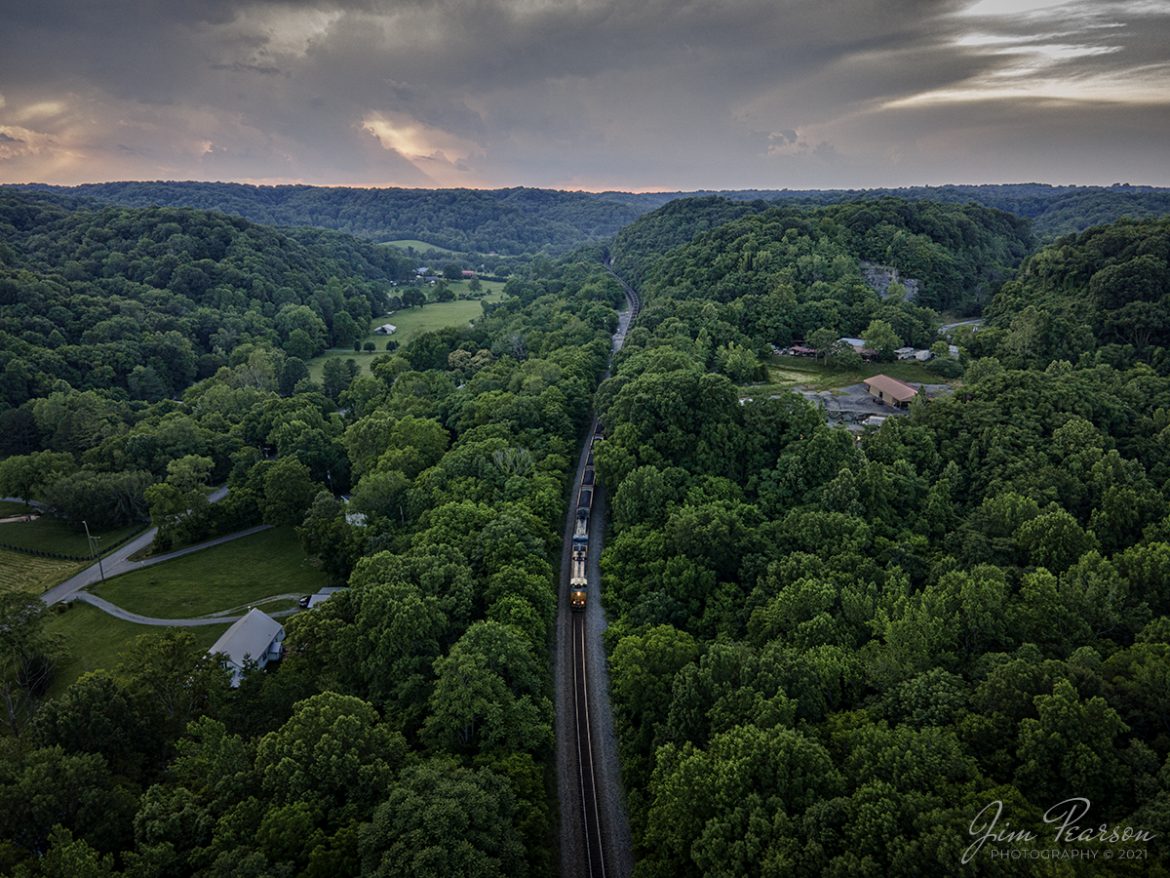 Southbound load of coal at dusk at Ridgetop, TN

CSX N302 heads south as it snakes its way through the valley as its tail end still exits Baker Tunnel back around the hills at Ridgetop, Tennessee on the Henderson Subdivision, as the light of day begins to fade from the scene. This trainset runs from Evansville, IN (EVWR) to Stilesboro, GA with a load of coal from the Sugar Camp Mine at Akin, IL and is headed to Georgia Power's Bowen Plant to help keep the lights on!

Tech Info: Wide Photo: DJI Mavic Air 2 Drone, RAW, 4.5mm (24mm equivalent lens) f/2.8, 1/50, ISO 100, June 12, 2021.