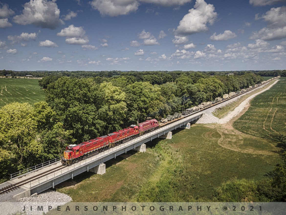 Ft. Campbell Rail southbound at Rock Bridge Branch bridge Hopkinsville, KY

I love it when a plan finally falls into place! If you've caught my last few posts, you'll recall that I've talked about issues I had a couple days ago when I was trying to get shots of Ft. Campbell Rail picking up military loads from the Ft. Campbell Wye after BNSF brought their equipment north on the CSX Henderson Subdivision. Well, today everything fell into place from my perspective as you can see in the attached photo. Train was where I wanted it, light was perfect, and I had great clouds!!

Here we have United States Army units USAX 6520, 6519 and 1871 headed from the Hopkinsville, KY on August 11th, 2021, as the train passes over the Rock Bridge Branch bridge, just south of Lovers Lane overpass.

This is another follow-up to my post yesterday where I discussed that my gear that just didn't want to co-operate! Well today, I used my iPhone 11pro instead of the iPhone 6s that I normally keep on my drone controller, and I didn't have any overheating problems at all and was able to fly normally. I guess the newer iPhones do a better job with the heat that the older ones as with the 11 I didn't get any warnings at all during the flights, and it was much hotter than the other day. 

Tech Info: Wide Photo: DJI Mavic Air 2 Drone, RAW, 4.5mm (24mm equivalent lens) f/2.8, 1/1000, ISO 100.