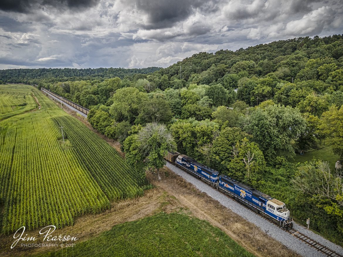 PAL loaded coal headed north through the valley at Spring Lick, Kentucky

Paducah and Louisville University of Kentucky locomotives 4522 and 2012 lead the Louisville Gas & Electric loaded coal train north through the valley at Spring Lick, Kentucky on its way to the Louisville Gas and Electric power plant in the Kosmosdale neighborhood of Louisville, Kentucky.

From the web: "The Paducah and Louisville Railway (reporting marks, PAL) is a regional operation based in Paducah, Kentucky that began operations in 1986 over ex-Illinois Central trackage.

Today it utilizes over 260 miles of railroad and is owned by P&L Transportation (previously known as Four Rivers Transportation), which itself is controlled by CSX Corporation (parent company to CSX Transportation, its railroad division). 

The P&L also operates the Appalachian & Ohio in West Virginia.  This road is predominately a coal hauler, which leases CSX's Cowen Subdivision, a former Baltimore & Ohio corridor."

Tech Info: Wide Photo: DJI Mavic Air 2 Drone, RAW, 4.5mm (24mm equivalent lens) f/2.8, 1/640, ISO 100, August 17, 2021.