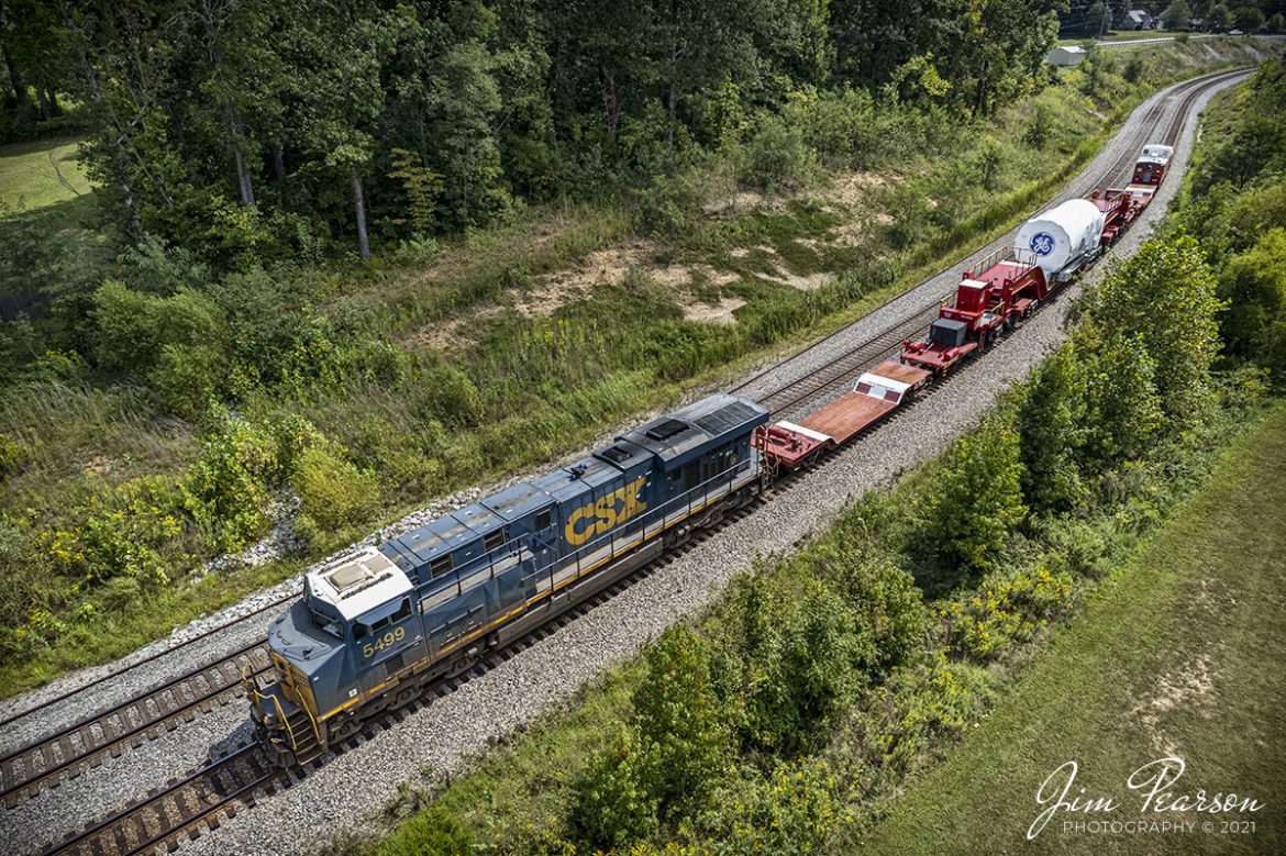 Today was a day of choices!! I had planned on chasing the Paducah and Louisville LGE coal train that had the UK 4522 locomotive leading as it went north from the mine to Louisville, but as I was waiting for it to depart with fellow railfan Barry Delaney I got word about a high and wide move on the CSX Henderson Subdivision! For me it was an easy choice really as the LGE train runs a lot, but we only get high and wide moves with a caboose once in a while!

It was a slow and steady move at 25mph as CSXT 5499 led W995 as it made its way through the S curve at Nortonville, Kentucky, on its way north on the Henderson Subdivision with a General Electric high and wide load.

These trains can take a long time to get from point A to Z as they are restricted normally to 25mph as their max speed when loaded and only 10mph through turnouts. There is a GE crew on the caboose and their job is to watch and if needed shift the load to either side by a distance of 12 inches to allow clearance for passing trains or other obstacles.

Always an easy and interesting train to chase in my book! I had planned to chase it to Henderson, Ky, but the crew ran out of their day and had to tie the train down at Hanson, but I still got a video and a couple of good shots between Nortonville and Hanson! It was a good day trackside!

Tech Info: DJI Mavic Air 2S Drone, RAW, 22mm, f/2.8, 1/800, ISO 100, September 13, 2021.

#trainphotography #railroadphotography #trains #railways #dronephotography #jimpearsonphotography