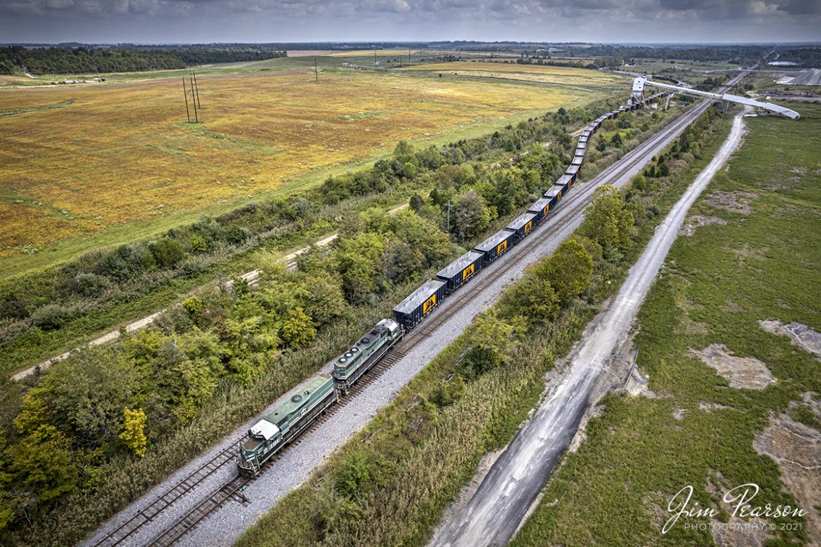Paducah and Louisville (PAL) 2104 and 2101 lead as they pull an empty rock train from the Scotty's Rock Yard loop, at their complex outside Madisonville, Kentucky, as they prepare to head north to Litchfield, KY, for another load of rock, on September 15th, 2021.

Tech Info: DJI Mavic Air 2S Drone, RAW, 22mm, f/2.8, 1/1000, ISO 100.

#trainphotography #railroadphotography #trains #railways #dronephotography #trainphotographer #railroadphotographer #jimpearsonphotography