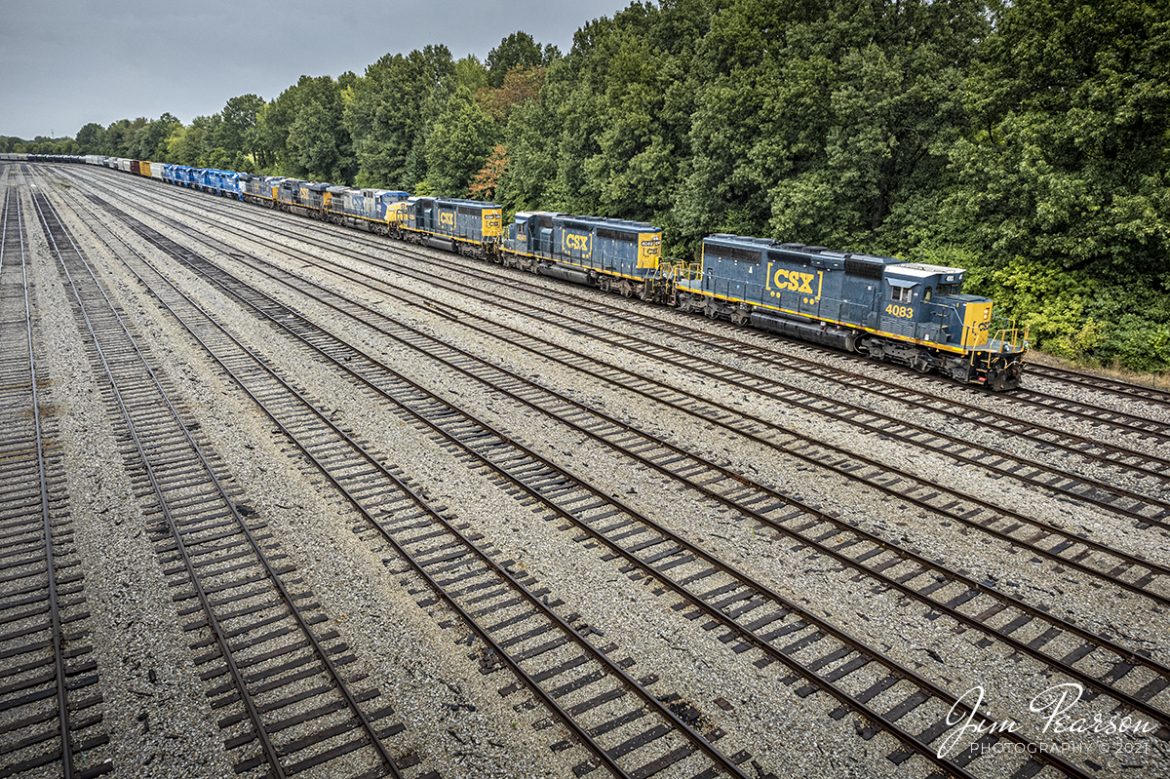 CSX J732 with CSXT 4083, 4049, 4384, 278, 749, 7231, GMTX 2149, 2135, 2201, 2152 and 2151 departs from the south end of CSX Atkinson Yard in Madisonville, Kentucky as it begins its return trip on the Henderson Subdivision to CSX Casky yard at Hopkinsville, KY after finishing its work at Madisonville. While an impressive power move for a local being pulled by SD40s, the lead three engines were the only ones running as they departed the empty south end at Atkinson.


Tech Info: DJI Mavic Air 2S Drone, RAW, 22mm, f/2.8, 1/500, ISO 100, September 17, 2021.


#trainphotography #railroadphotography #trains #railways #dronephotography #trainphotographer #railroadphotographer #jimpearsonphotography