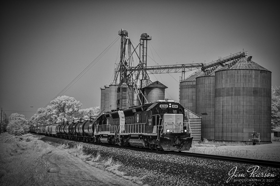 Infrared photo of Decatur & Eastern Illinois Railroad units WAMX 4244 and 4234 as they lead local 101 on its way to Terre Haute, Indiana as it passes through Carmargo, Illinois on July 21st, 2021.

According to Wikipedia: "The Decatur & Eastern Illinois Railroad (reporting mark DREI) is an American regional railroad that is a subsidiary of Watco operating in eastern Illinois and western Indiana.

In January 2018, CSX Transportation announced that it was seeking offers to buy the Decatur Subdivision and the Danville Secondary Subdivision as part of a system-wide sale of low-traffic routes, and in July, Watco, via the DREI, was identified as the winning bidder. Following regulatory approval from the Surface Transportation Board, The DREI began operations on September 9, 2018.

The DREI operates two intersecting routes totaling 126.7 miles (203.9 km)the former Decatur Subdivision between Montezuma, Indiana and Decatur, Illinois, and the former Danville Subdivision between Terre Haute, Indiana and Olivet, Illinois. It interchanges traffic with CSX, the Eastern Illinois Railroad, the Norfolk Southern Railway, the Canadian National Railway, and the Union Pacific Railroad. The railroad is headquartered in Decatur, Illinois."

Tech Info: Fuji XT-1, RAW, sensor converted to 720nm B&W IR, Fuji 18-55 @33mm, f/7.1, 1/250, ISO 200.

#jimpearsonphotography #infraredphotography #irphotography, #infraredtrains #trainphotographer #railroadphotographer