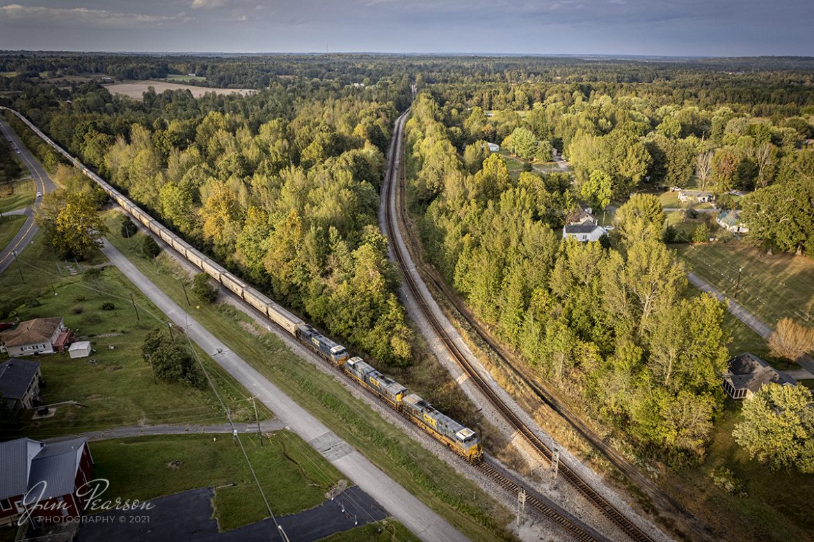 The fall harvests have started moving south on the CSX Henderson Subdivision as with many other railroads around the country. Here I caught CSX G390 as the late evening light rakes across the landscape with a Grain Express unit train, headed up by CSXT 5213, 3021 and 9010 as they approach Mortons Junction at Mortons Gap, Kentucky, on October 13th, 2021. 

To the right is the cutoff track that bypasses downtown Earlington and Madisonville, Ky allowing dispatch to run trains past each other, and the grain train is on the mainline that goes through the towns. In the past there has been movements to double-track the cutoff and pull up the track in the two towns for a rails to trails, but the money for such an venture has never been raised.

Tech Info: DJI Mavic Air 2S Drone, RAW, 22mm, f/2.8, 1/500, ISO 130.

#trainphotography #railroadphotography #trains #railways #dronephotography #trainphotographer #railroadphotographer #jimpearsonphotography