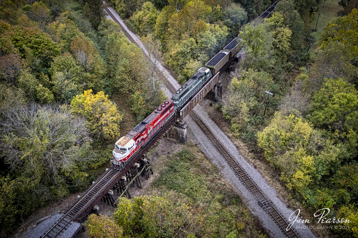 X marks the spot! I keep returning to this location known as Arklow, where the CSX Henderson Subdivision passes under the Paducah and Louisville Railway at Madisonville, KY, as someday I'll catch a train on both lines at the same time! It's just a matter of patience, determination, and a lot of luck! It hasn't happened yet, but it will!

Here we find Paducah and Louisville Railway's (PAL) Louisville Gas and Electric loaded coal train as it heads north with PAL 2013, University of Louisville locomotive leading the way, on October 25th, 2021, passing over the CSX Henderson Subdivision at Arklow, as the fall color begins to show in the trees.

Tech Info: DJI Mavic Air 2S Drone, RAW, 22mm, f/2.8, 1/160, ISO 100.

#trainphotography #railroadphotography #trains #railways #dronephotography #trainphotographer #railroadphotographer #jimpearsonphotography