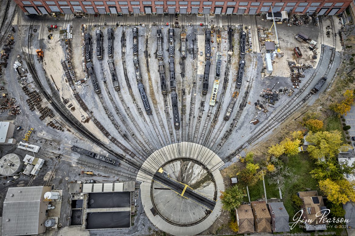 Locomotives galore sit outside the Norfolk Southern Juniata Locomotive Shops in downtown Altoona, Pennsylvania in this birds-eye view on November 3rd, 2021. The shops are just part of the large complex called Altoona Works, or Altoona Terminal on the NS Roanoke District.

According to Wikipedia: Altoona Works (also known as Altoona Terminal) is a large railroad industrial complex in Altoona, Pennsylvania. It was built between 1850 and 1925 by the Pennsylvania Railroad (PRR) to supply the railroad with locomotives, railroad cars and related equipment. For many years it was the largest railroad shop complex in the world.

From the NS Website: At our Juniata locomotive shop in Altoona, Pennsylvania, Norfolk Southern regularly recycles locomotives into more efficient machines, benefiting both customers and the environment. We can strip a locomotive down to the bare frame and completely rebuild it, including the engine, alternator, wiring, cab, trucks, combos and running gearall in 6.5 days. 

NS also operates our own indoor locomotive emissions-testing facility, unique among railroads, which allows us to test locomotives year-round to increase fuel efficiency and meet EPA regulations.

Tech Info: DJI Mavic Air 2S Drone, RAW, 22mm, f/2.8, 1/120, ISO 120.

#trainphotography #railroadphotography #trains #railways #dronephotography #trainphotographer #railroadphotographer #jimpearsonphotography