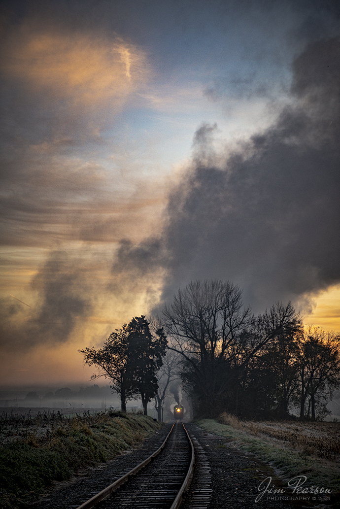 As the rising sun begins to light the sky, Norfolk and Western 475 heads west on the Strasburg Railroad at dawn, through the cold autumn air as it approaches the Esbenshade Road Crossing on November 7th, 2021, at Strasburg, Pennsylvania. 

According to Wikipedia: Strasburg Railroad (Norfolk and Western) No. 475 is a 4-8-0 "Mastodon" type steam locomotive owned and operated by the Strasburg Railroad outside of Strasburg, Pennsylvania. Built by the Baldwin Locomotive Works in June 1906, it was part of the Norfolk and Western's first order of M class numbered 375-499. Today, No. 475 is the only operating 4-8-0 type in North America and the Strasburg Rail Road's oldest operating steam locomotive.

Tech Info: Nikon D800, RAW, Sigma 24-70 @ 70mm, f/2.8, 1/400, ISO 280.

#trainphotography #railroadphotography #trains #railways #jimpearsonphotography #trainphotographer #railroadphotographer