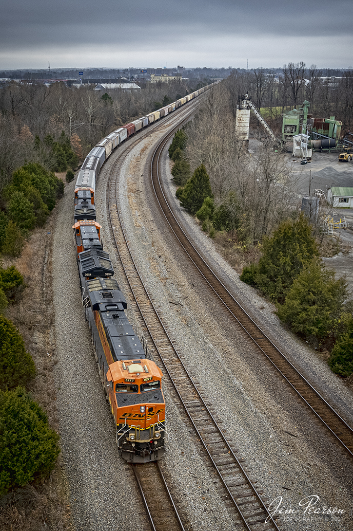 December 10, 2021 - CSX W810, with BNSF 6277 sits at Arklow, just north of Madisonville, Kentucky as it waits for the arrival of the southbound hot intermodal I025 on the Henderson Subdivision. K810 was running with BNSF 6277,3954,6356 leading and CSXT 3155, NS 8084, NS 1005 as DPUs. 

The storm clouds in the background were the first signs of the major tornado and storm out break that created a path of destruction across 6 states and derailed CSX Q500 later in the night.

Tech Info: DJI Mavic Air 2S Drone, RAW, 22mm, f/2.8, 1/250, ISO 200.

#trainphotography #railroadphotography #trains #railways #jimpearsonphotography #trainphotographer #railroadphotographer