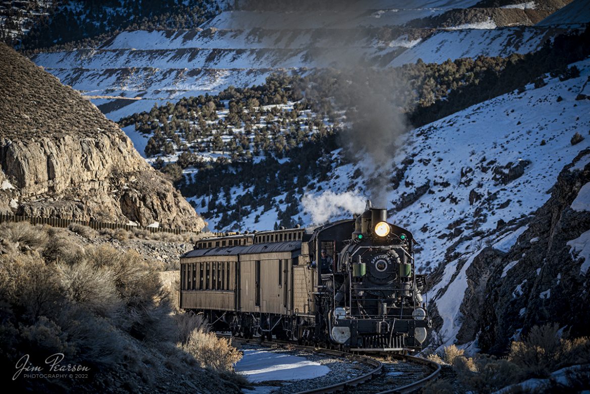 Nevada Northern Railway steam locomotive #81 pulls a passenger train through one of the S curves in Robinson Canyon under the control of engineer Don Hepler, as it heads south out of Ely, Nevada during the museums Winter Photo Charter event as the light begins to drop behind the mountains on February 13th, 2022.


According to Wikipedia: The Nevada Northern Railway Museum is a railroad museum and heritage railroad located in Ely, Nevada and operated by a historic foundation dedicated to the preservation of the Nevada Northern Railway.


The museum is situated at the East Ely Yards, which are part of the Nevada Northern Railway. The site is listed on the United States National Register of Historic Places as the Nevada Northern Railway East Ely Yards and Shops and is also known as the "Nevada Northern Railway Complex". The rail yards were designated a National Historic Landmark District on September 27, 2006. The site was cited as one of the best-preserved early 20th-century railroad yards in the nation, and a key component in the growth of the region's copper mining industry. Developed in the first decade of the 20th century, it served passengers and freight until 1983, when the Kennecott Copper Company, its then-owner, donated the yard to a local non-profit for preservation. The property came complete with all the company records of the Nevada Northern from its inception.

Engine #81 is a "Consolidation" type (2-8-0) steam locomotive that was built for the Nevada Northern in 1917 by the Baldwin Locomotive Works in Philadelphia, PA, at a cost of $23,700. It was built for Mixed service to haul both freight and passenger trains on the Nevada Northern railway.


Tech Info: Nikon D800, RAW, Sigma 150-600 @ 210mm, f/5.6, 1/800, ISO 250.


#trainphotography #railroadphotography #trains #railways #jimpearsonphotography #trainphotographer #railroadphotographer #steamtrains #nevadanorthernrailway