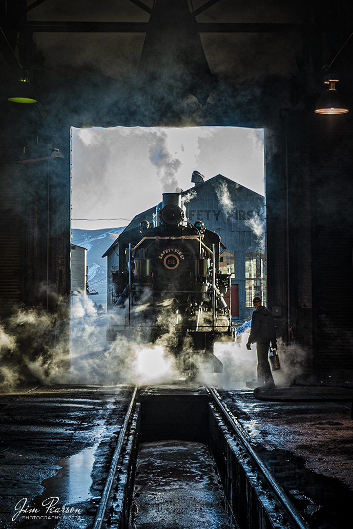 A crew member on Nevada Northern Railway steam locomotive #81 follows his engine out the engine house door at they prepare for the day's activities at Ely, Nevada during the museums Winter Photo Charter event with engineer on the morning of February 13th, 2022.


According to Wikipedia: "The Nevada Northern Railway Museum is a railroad museum and heritage railroad located in Ely, Nevada and operated by a historic foundation dedicated to the preservation of the Nevada Northern Railway.


The museum is situated at the East Ely Yards, which are part of the Nevada Northern Railway. The site is listed on the United States National Register of Historic Places as the Nevada Northern Railway East Ely Yards and Shops and is also known as the "Nevada Northern Railway Complex". The rail yards were designated a National Historic Landmark District on September 27, 2006. The site was cited as one of the best-preserved early 20th-century railroad yards in the nation, and a key component in the growth of the region's copper mining industry. Developed in the first decade of the 20th century, it served passengers and freight until 1983, when the Kennecott Copper Company, its then-owner, donated the yard to a local non-profit for preservation. The property came complete with all the company records of the Nevada Northern from its inception."

Engine #81 is a "Consolidation" type (2-8-0) steam locomotive that was built for the Nevada Northern in 1917 by the Baldwin Locomotive Works in Philadelphia, PA, at a cost of $23,700. It was built for Mixed service to haul both freight and passenger trains on the Nevada Northern railway.


Tech Info: Nikon D800, RAW, Nikon 10-24 @ 24mm, f/4.5, 1/60, ISO 100.


#trainphotography #railroadphotography #trains #railways #jimpearsonphotography #trainphotographer #railroadphotographer #steamtrains #nevadanorthernrailway