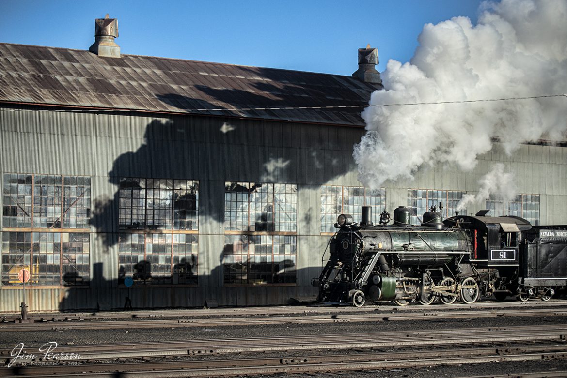 Nevada Northern Railway engine 81 chases it's shadow past the Repair in Place (RIP) building as it moves through the yard at Ely, Nevada on February 13th, 2022. 

The Repair in place building, which is better known as the RIP, and during the ore carrying days ore cars led a very rough life, between being banged with shovels, boulders being dropped into them and wear and tear of everyday use. The RIP was built to allow repair of the cars indoors, whereas before they were repaired outdoors all year long. Today the building is used for ongoing restoration projects by the museum.

Nevada Northern No. 81 is a "Consolidation" type (2-8-0) steam locomotive that was built for the Nevada Northern in 1917 by the Baldwin Locomotive Works in Philadelphia, PA, at a cost of $23,700. It was built for Mixed service to haul both freight and passenger trains on the Nevada Northern railway.

According to Wikipedia: The Nevada Northern Railway Museum is a railroad museum and heritage railroad located in Ely, Nevada and operated by a historic foundation dedicated to the preservation of the Nevada Northern Railway.

Tech Info: Nikon D800, RAW, Nikon 70-300mm @ 78mm, f/4.5, 1/8000, ISO 1000.

#trainphotography #railroadphotography #trains #railways #jimpearsonphotography #trainphotographer #railroadphotographer #steamtrains #nevadanorthernrailway