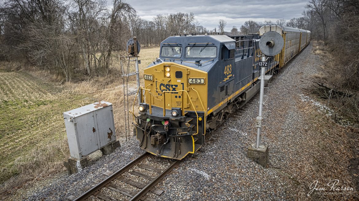 CSX 483 leads CSX Q228 passes a set of searchlight signals at MP 137.2, just east of Henderson, Kentucky on the CSX Texas Line (LH&StL Subdivision) as it as it heads west to the Toyota Plant in Princeton, Indiana from Louisville, KY on March 7th, 2022.

CSX currently runs two through trains daily along the line and it has been open now for about two weeks. It also sees several locals as well. While the bridge was shut down trains were pretty much just locals between Louisville and Henderson, Ky (where the Texas line runs).

According to Wikipedia: The LH&STL Subdivision is a railroad line owned by CSX Transportation in the U.S. state of Kentucky. It was originally built as the Louisville, Henderson, and Texas Railway in 1882, with the intent of building a line to Texas by way of St. Louis, Missouri. It was nicknamed "The Texas Line," by which it is still often referred today. The line fell into bankruptcy and was reorganized as the Louisville, Henderson, and St. Louis Railway in 1896. The rail line was acquired by the Louisville and Nashville Railroad in 1929; the parent company still exists and holds other rail-related assets. Through a series of mergers, the line is now operated by CSX.

The line runs from Louisville, Kentucky, to Henderson, Kentucky, for a total of 136.5 miles (219.7 km). At its east end the line continues west from the Louisville Terminal Subdivision, and at its west end the line continues west as the Henderson Subdivision of the Nashville Division.

Tech Info: DJI Mavic Air 2S Drone, RAW, 22mm, f/2.8, 1/250, ISO 150.

#trainphotography #railroadphotography #trains #railways #dronephotography #trainphotographer #railroadphotographer #jimpearsonphotography