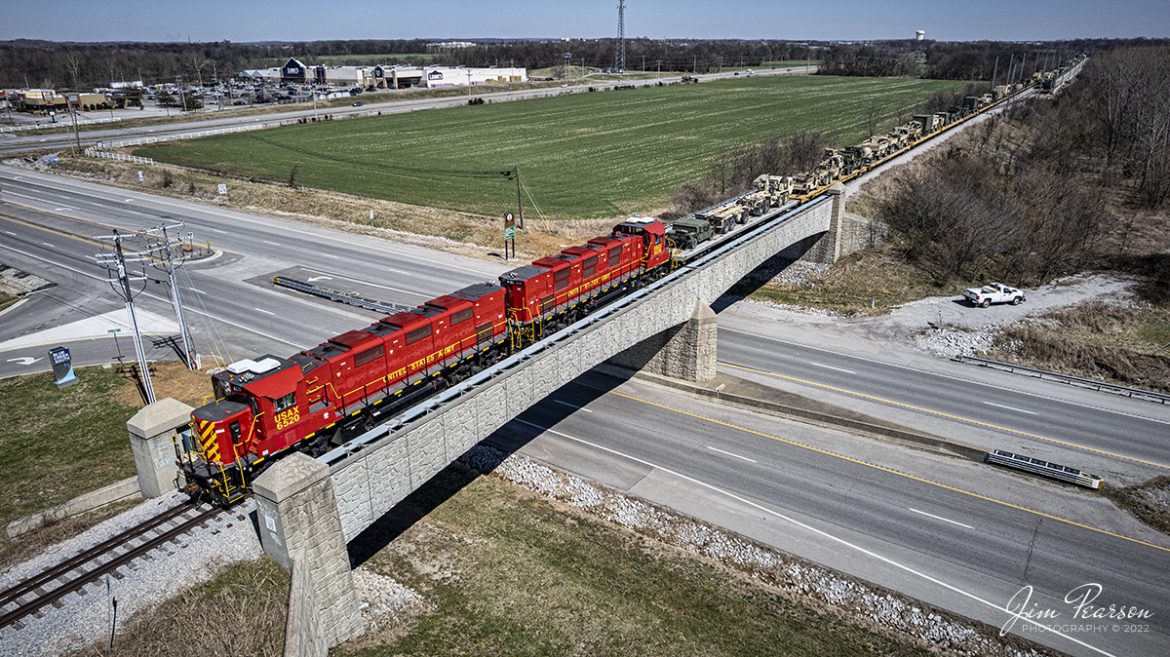 On March 14th, 2022 United States Army Gensets 6520 and 6519 build air on their train as they prepare to pull south to Ft. Campbell, Ky, over US 41A at Hopkinsville, Kentucky with another loaded military train, returning from military exercises somewhere out west.  

The equipment was delivered by CSX S864, which was a Rose Lake, IL  Hopkinsville, Ky train and was one of about 5 trains that ran down the CSX CE&D and Henderson Subdivisions to Hopkinsville over the past week, returning equipment from training to Ft. Campbell.

Tech Info: DJI Mavic Air 2S Drone, RAW, 22mm, f/2.8, 1/2500, ISO 100.

#trainphotography #railroadphotography #trains #railways #dronephotography #trainphotographer #railroadphotographer #jimpearsonphotography