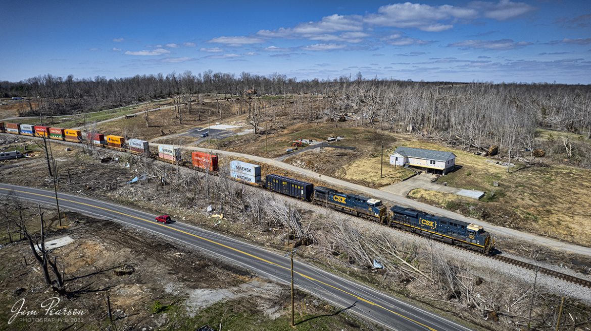 April 1, 2022  CSX I025 rolls though the site of the December 10th, 2021, tornado that derailed CSX Q500 on the Henderson Subdivision and devastated the small community Barnsley, Kentucky, and many others along its path as it plowed through 6 states. After four months a lot of debris has been cleared, homeowners have begun to rebuild their homes and lives. 


Fortunately, this community didnt lose anyone to the storm and there were miracles, one of which was when two Hopkins County Sheriff Deputies along with other rescuers found 3- and 15-month baby boys safe inside a bathtub where they'd been hidden to shelter before the Kentucky tornado that killed 78 people in its path, sucked up the whole tub with them inside and flung it from their house. 


The boys - 15-month-old Kaden and three-month-old Dallas - were ripped from the home in Barnsley when the tornado struck on December 10. Their grandmother had tucked them into the bathtub for shelter with blankets and a Bible as the storm bore down on them. They all survived the tornado.


Tech Info: DJI Mavic Air 2S Drone, RAW, 22mm, f/2.8, 1/2000, ISO 110.


#trainphotography #railroadphotography #trains #railways #jimpearsonphotography #trainphotographer #railroadphotographer #jimpearsonphotography