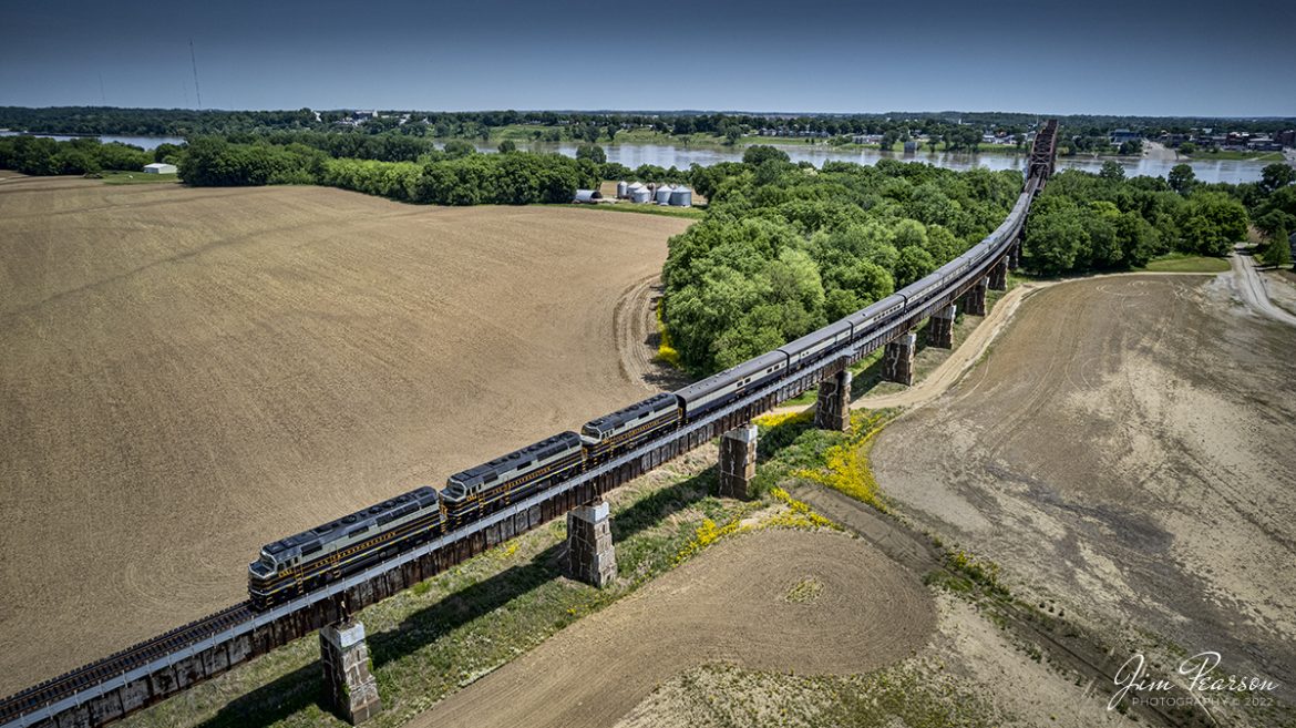 May 12, 2022  CSX P001-09 Presidential Office Car passenger train heads north over the Ohio river bridge from Henderson, Ky down the Viaduct into Evansville, Indiana on the Henderson Subdivision with CSXT 1, 2 and 3 leading the way.

CSX Transportation has repainted 3 of its executive fleet F40PH locomotives in a paint scheme inspired by predecessor Baltimore & Ohio and a fleet of cars to finish out the train set. The city of Baltimore chartered the railroad on Feb. 28, 1827, to build west to a suitable point on the Ohio River. Ground was broken on July 4, 1828, at Carrollton, Md. By 1929 the railroad operated 5,658 miles of track and had 2,364 locomotives. In the 1970s the B&O became part of Chessie System and in the 1980s it became part of CSX.

Tech Info: DJI Mavic Air 2S Drone, RAW, 22mm, f/2.8, 1/1500, ISO 110.

#trainphotography #railroadphotography #trains #railways #dronephotography #trainphotographer #railroadphotographer #jimpearsonphotography