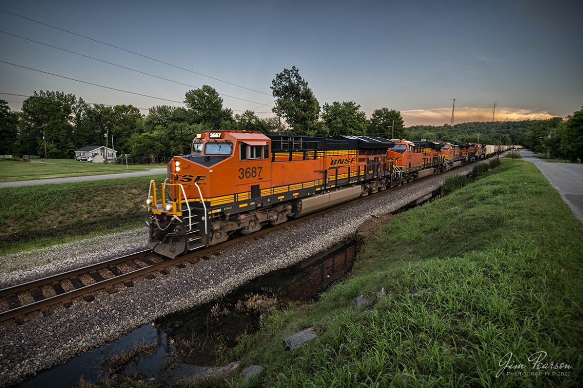 What could be better than the light at dusk and five beautiful BNSF units leading a northbound loaded potash and empty ethanol combined train? Well, actually I can think of a lot of things, but still a nice picture! 

I first caught this CSX B207 as it headed across the CR Drawbridge in downtown Nashville, Tennessee as it began its trip north on July 12th, 2022. That was about 4pm in the afternoon and I had no idea Id catch up with it as it was about 5:30 before I left town, and traffic was pretty congested all the way to Clarksville, TN! But here I was, ahead of it at Mortons Gap, KY almost 4 hours later, on the Henderson Subdivision, getting this nice light shot at 7pm! There was also two CSX units on it as mid train DPUs.

The power was: BNSF 3687, 8028, 4397, 6714, 5992 leading with CSXT 3430 and 3387 as mid train DPUs. Actually, they were also heading up the empty ethanol train.

Tech Info: Nikon D800, RAW, Nikon 10-24 @ 10mm, f/4, 1/320, ISO 1100.

#trainphotography #railroadphotography #trains #railways #jimpearsonphotography #trainphotographer #railroadphotographer #regionalrailroad