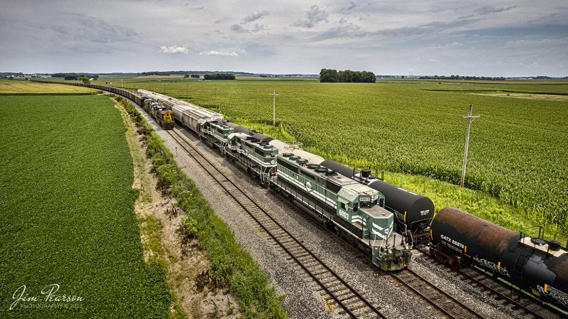 Evansville Western Railway 6003 leads the daily local run between Mt. Vernon, IN and Evansville, IN as it approaches the north end of Nations siding on its return trip to Mt. Vernon on July 15th, 2022.

According to Wikipedia: The Evansville Western Railway (reporting mark EVWR) is a Class III common carrier shortline railroad operating in the southern Illinois and Indiana region. It is one of three regional railroad subsidiaries owned and operated by P&L Transportation. The other one is the Appalachian & Ohio Railroad operating out of West Virginia. 

Tech Info: DJI Mavic Air 2S Drone, RAW, 22mm, f/2.8, 1/2500, ISO 130.

#trainphotography #railroadphotography #trains #railways #dronephotography #trainphotographer #railroadphotographer #jimpearsonphotography