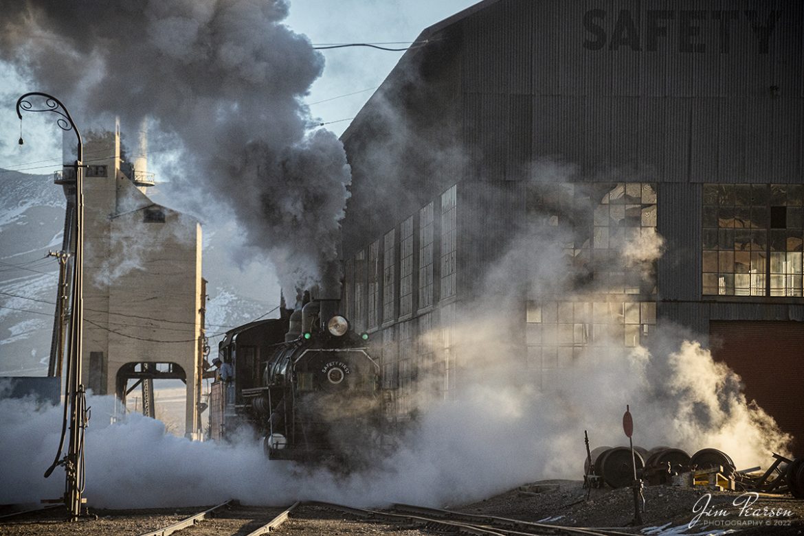 A crew member on Nevada Northern Railway steam locomotive #81 keeps a watchful eye as they back up to the coaling tower at Ely, Nevada during the museums Winter Photo Charter event on the morning of February 13th, 2022.

According to Wikipedia: "The Nevada Northern Railway Museum is a railroad museum and heritage railroad located in Ely, Nevada and operated by a historic foundation dedicated to the preservation of the Nevada Northern Railway.

The museum is situated at the East Ely Yards, which are part of the Nevada Northern Railway. The site is listed on the United States National Register of Historic Places as the Nevada Northern Railway East Ely Yards and Shops and is also known as the "Nevada Northern Railway Complex". The rail yards were designated a National Historic Landmark District on September 27, 2006. The site was cited as one of the best-preserved early 20th-century railroad yards in the nation, and a key component in the growth of the region's copper mining industry. Developed in the first decade of the 20th century, it served passengers and freight until 1983, when the Kennecott Copper Company, its then-owner, donated the yard to a local non-profit for preservation. The property came complete with all the company records of the Nevada Northern from its inception."

Engine #81 is a "Consolidation" type (2-8-0) steam locomotive that was built for the Nevada Northern in 1917 by the Baldwin Locomotive Works in Philadelphia, PA, at a cost of $23,700. It was built for Mixed service to haul both freight and passenger trains on the Nevada Northern railway.

Tech Info: Nikon D800, RAW, Nikon 70-300 @ 145mm, f/4.8, 1/8000, ISO 2000.

#trainphotography #railroadphotography #trains #railways #jimpearsonphotography #trainphotographer #railroadphotographer #steamtrains #nevadanorthernrailway