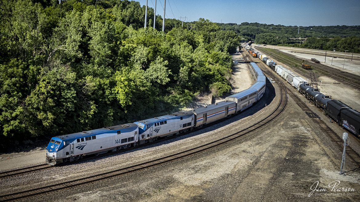 Amtrak 144 and 14 pass through Santa Fe Junction as it heads for Union Station in downtown Kansas City, Missouri on June 30th, 2022, from Chicago, Illinois.

Santa Fe Junction sees on average over 100 trains a day and it hosts the double decked railroad (ATSF Double Deck Railroad) bridge that crosses the Kansas River into Missouri, a triple crossing in addition to Tower 3, which is used by maintenance of way these days. The junction is partly in Missouri and Kansas and sees BNSF, UP, KCT, Amtrak, KCS, NS and CP traffic, from what I saw during my visit.

The tracks through the junction have been reduced or changed around over the years, but the area remains one of KCs Busiest locations.

Tech Info: DJI Mavic Air 2S Drone, RAW, 22mm, f/2.8, 1/1500, ISO 110.

#trainphotography #railroadphotography #trains #railways #dronephotography #trainphotographer #railroadphotographer #jimpearsonphotography