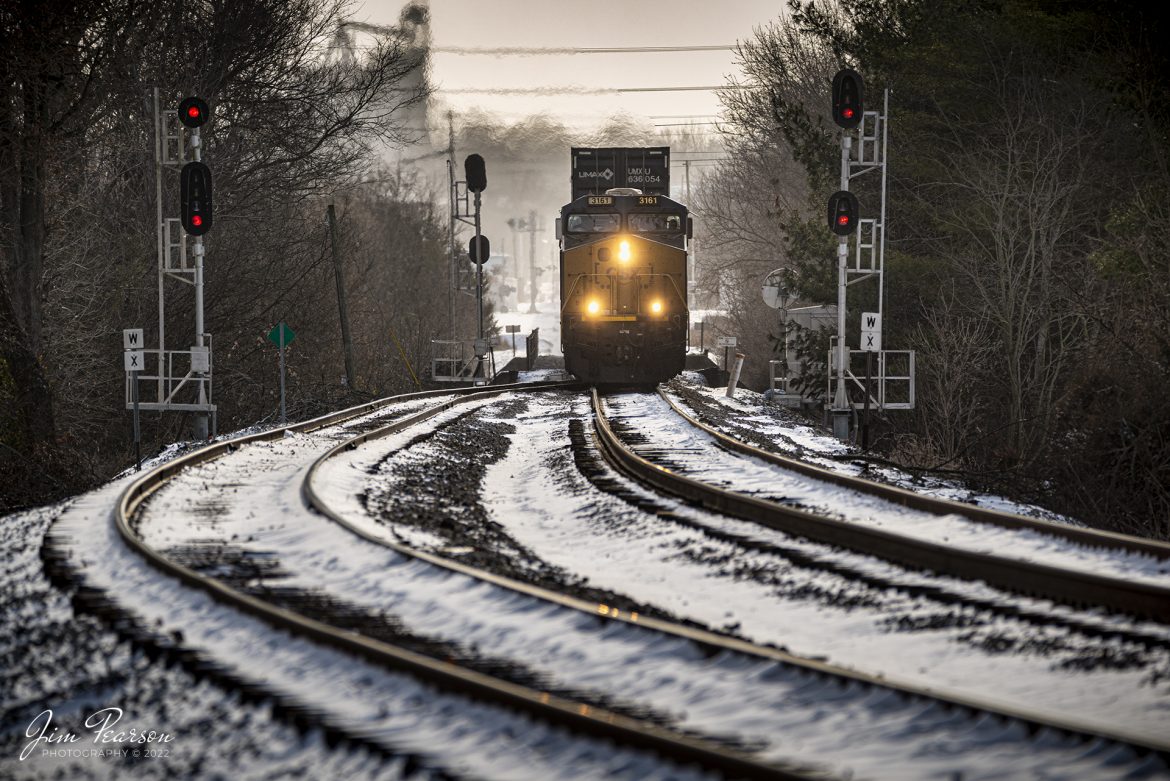 CSXT 3161 heads up CSX I028 as it spits the signals at the south end of the siding at Latham as it makes its way north through the freshly fallen snow at Hopkinsville, Kentucky on the Henderson Subdivision in the 5-degree weather! This is the scene I posted a Waiting on a Train photo from last Friday, December 23rd, 2022.

Tech Info: Nikon D800, RAW, Sigma 150-600 @ 310mm, f/5.6, 1/500, ISO 110.

#trainphotography #railroadphotography #trains #railways #jimpearsonphotography #trainphotographer #railroadphotographer #csxhendersonsubdivision #trainsinthesnow
