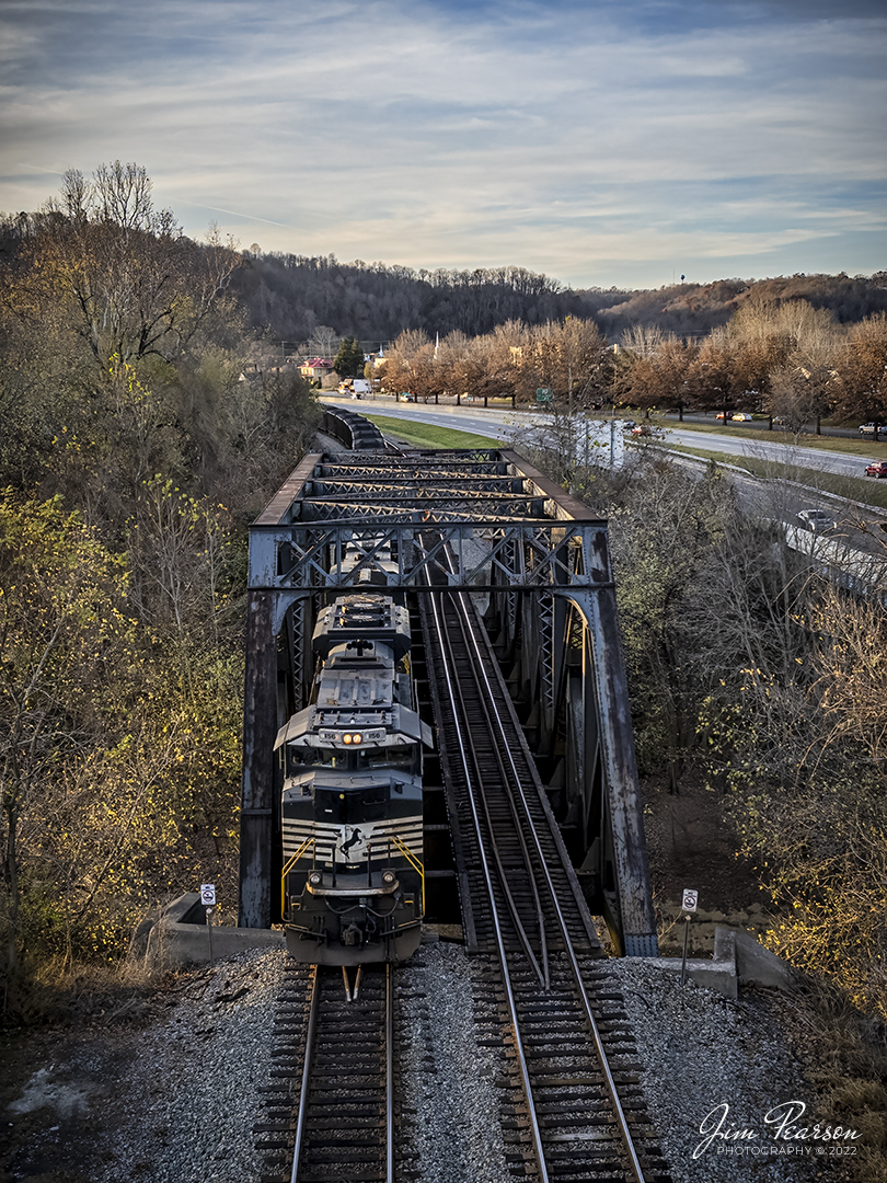 Norfolk Southern 1156 leads a loaded westbound coal train out of Sciotoville, Ohio, on the NS Kenova District as it passes over the Little Scioto River on November 7th, 2022.

Sciotoville is a neighborhood in the city of Portsmouth in Scioto County, Ohio. It is located at the intersection of U.S. 52 and State Route 335 between the village of New Boston and Wheelersburg in Scioto County along the northern bank of the Ohio River.

Tech Info: DJI Mavic Air 2S Drone, 22mm, f/2.8, 1/350, ISO 100.

#trainphotography #railroadphotography #trains #railways #dronephotography #trainphotographer #railroadphotographer #jimpearsonphotography #trainsfromtheair