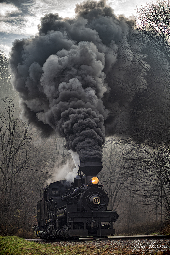 Cass Scenic Railway Shay locomotive number 11, (C-90-3) passes through the crossing at Black Mountain Road as it starts the climb up the mountain, during the Cass Rail Heritage Photography Weekend, at Cass, West Virginia on November 5th, 2022

Founded in 1901 by the West Virginia Pulp and Paper Company (now WestRock), Cass was built as a company town to serve the needs of the men who worked in the nearby mountains cutting spruce and hemlock for the West Virginia Spruce Lumber Company, a subsidiary of WVP&P. At one time, the sawmill at Cass was the largest double-band sawmill in the world. It processed an estimated 1.25 billion board feet (of lumber during its lifetime. In 1901 work started on the 4 ft 8+1⁄2 in standard gauge railroad, which climbs Back Allegheny Mountain. 

The railroad eventually reached a meadow area, now known as Whittaker Station, where a logging camp was established for the immigrants who were building the railroad. The railroad soon reached the top of Gobblers Knob, and then a location on top of the mountain known as 'Spruce'. The railroad built a small town at that location, complete with a company store, houses, a hotel, and a doctor's office. Work soon commenced on logging the red spruce trees, which grew in the higher elevations.

Tech Info: Nikon D800, RAW, Sigma 24-70mm @ 70mm, f/4, 1/640, ISO 220.

#trainphotography #railroadphotography #trains #railways #trainphotographer #railroadphotographer #jimpearsonphotography #cassscenicrailway #steamtrains