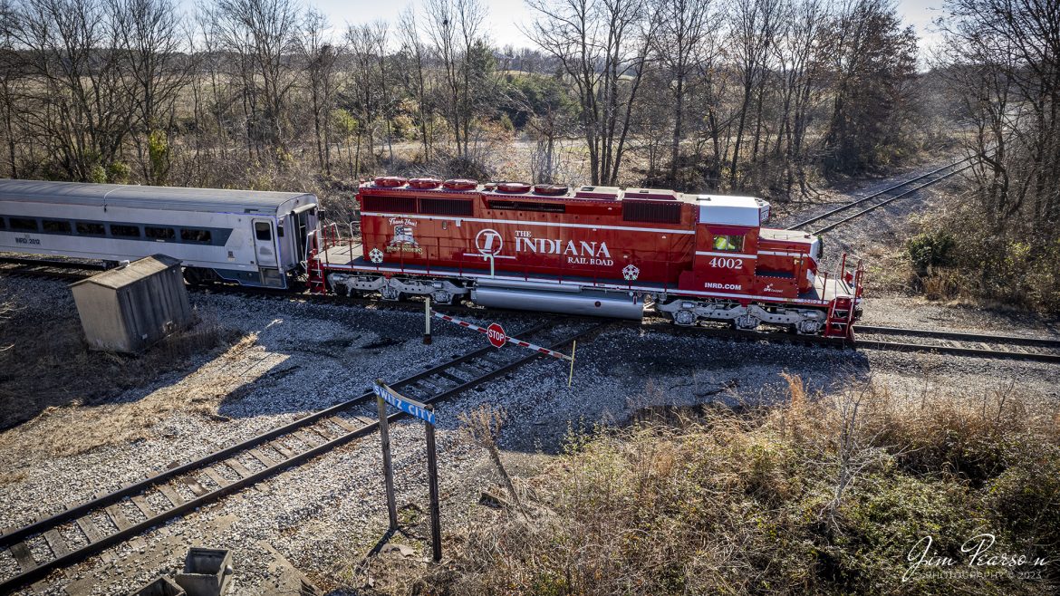 The Indiana Railroad (INRD), “Honoring First Responders” locomotive 4002, leads the railroads Santa Train on December 3rd, 2022, as they pass over the Indiana Southern diamond at Switz City, Indiana. The Saturday run of the train made stops between Bloomington and Jasonville, IN to allow the kids in various towns along the way to come on board and have a brief visit with Santa Claus. 

The Indiana Railroad (reporting mark INRD) is a United States Class II railroad, originally operating over former Illinois Central Railroad trackage from Newton, Illinois, to Indianapolis, Indiana, a distance of 155 miles (249 km). This line, now known as the Indiana Rail Road's Indianapolis Subdivision, comprises most of the former IC/ICG line from Indianapolis to Effingham, Illinois; Illinois Central successor Canadian National Railway retains the portion from Newton to Effingham. 

INRD also owns a former Milwaukee Road line from Terre Haute, Indiana, to Burns City, Indiana (site of the Crane Naval Surface Warfare Center), with trackage rights extending to Chicago, Illinois. INRD no longer serves Louisville, Kentucky, and the Port of Indiana on the Ohio River at Jeffersonville, Indiana, through a haulage agreement with the Louisville & Indiana Railroad (LIRC).

Tech Info: DJI Mavic Air 2S Drone, RAW, 22mm, f/2.8, 1/725, ISO 110.

#trainphotography #railroadphotography #trains #railways #dronephotography #trainphotographer #railroadphotographer #jimpearsonphotography #inrd #IndianaRailroad #RegionalRailroad #trainsfromtheair