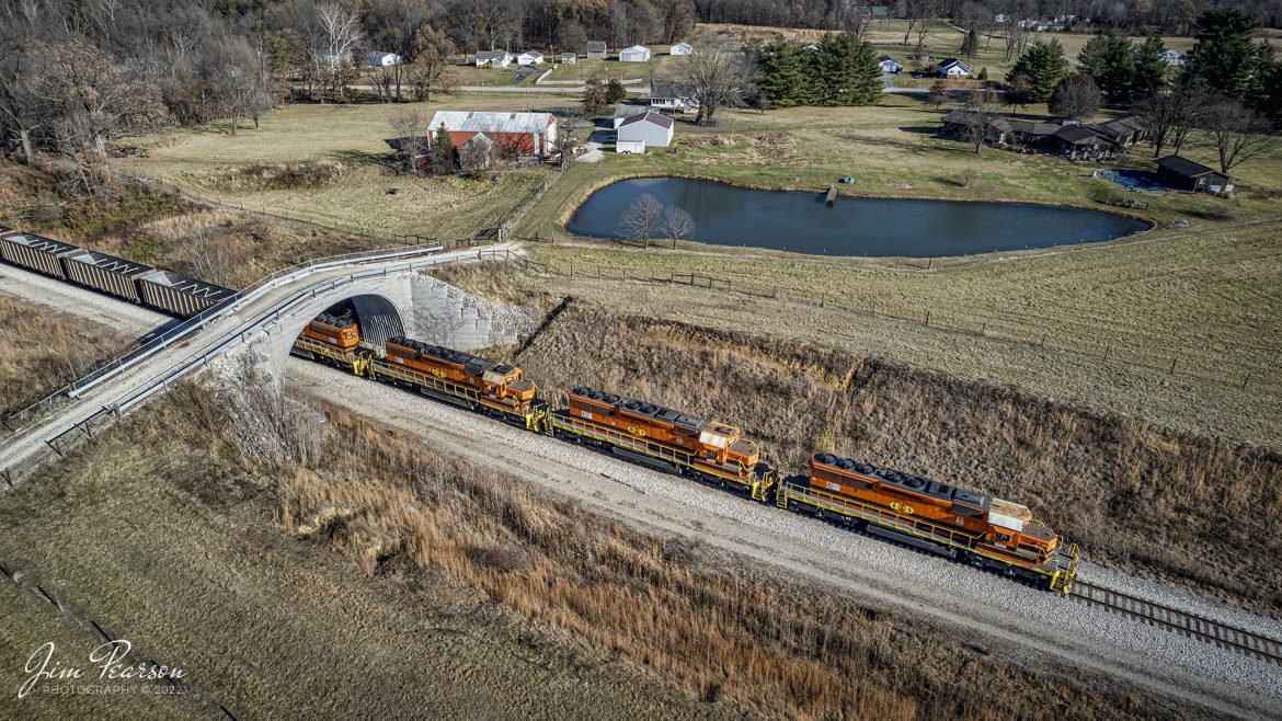 Indiana Southern Railroad locomotive 3382 leads an empty coal train down the Bear Run Mine lead as it heads to the loop to pickup another load of coal on December 3rd, 2022 as it passes under a farm overpass at Dugger, Indiana.

According to Wikipedia: The Indiana Southern Railroad (reporting mark ISRR) is a short line or Class III railroad operating in the United States state of Indiana. It began operations in 1992 as a RailTex property and was acquired by RailAmerica in 2000. RailAmerica was acquired by Genesee & Wyoming in December 2012.

Tech Info: DJI Mavic Air 2S Drone, 22mm, f/2.8, 1/1250, ISO 100.

#trainphotography #railroadphotography #trains #railways #dronephotography #trainphotographer #railroadphotographer #jimpearsonphotography