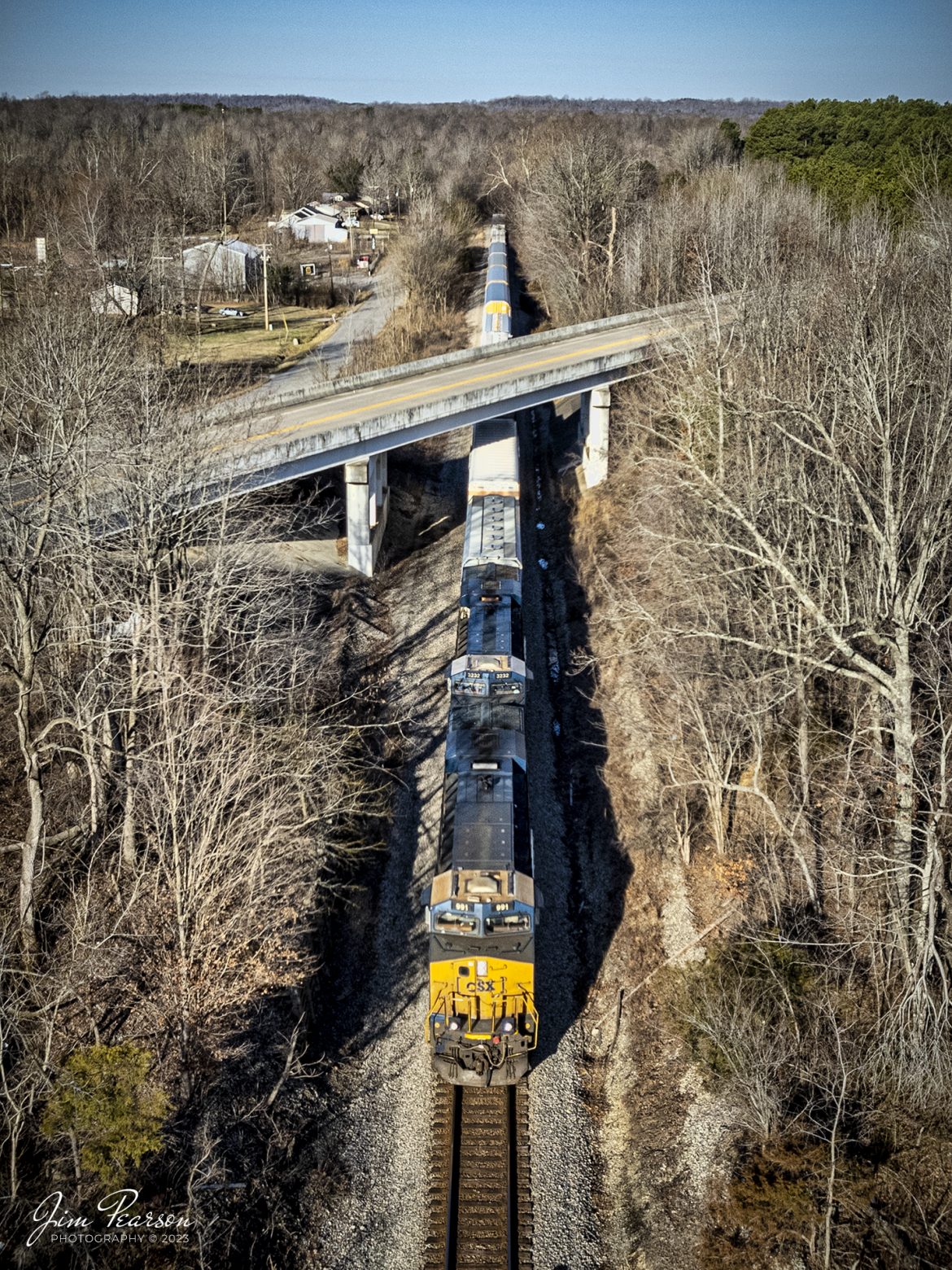 CSXT 991 leads hot intermodal I025 as it passes under the US 41 overpass at Bremen, Kentucky as it heads south on the Henderson Subdivision on February 13th, 2023. The first string of cars behind the power are autoracks loaded with Tesla Automobiles bound for Florida. (Note that this is a cropped photo and the drone was moved away before the train reached its location.)

Tech Info: DJI Mavic Air 2S Drone, 22mm, f/2.8, 1/1600, ISO 140.

#trainphotography #railroadphotography #trains #railways #dronephotography #trainphotographer #railroadphotographer #jimpearsonphotography #csx #trainsfromadrone #kentuckytrains #csxhendersonsubdivision L
