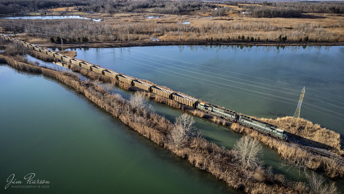 Evansville Western Railway 4510 and Paducah & Louisville Railway 4523 lead empty coal train WYX3 as it passes through the wetlands area on the way to pickup another load of coal at the Warrior Coal Mine loop outside of Nebo, Kentucky, on February 13th, 2023.

Tech Info: DJI Mavic Air 2S Drone, 22mm, f/2.8, 1/400, ISO 100.

#trainphotography #railroadphotography #trains #railways #dronephotography #trainphotographer #railroadphotographer #jimpearsonphotography #trainsfromadrone #kentuckytrains #paducahandlouisvillerailway #coaltrain #PAL