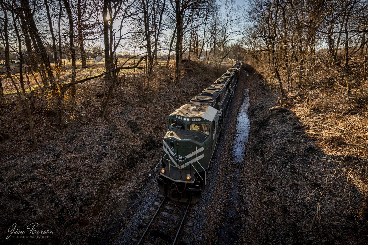 Evansville Western Railway 4510 leads an empty coal train through a cut on the east leg of the Paducah and Louisville Railways wye at Madisonville, Kentucky as they make their way to the Warrior Coal Mine lead to pickup another load of coal from the Warrior Loop, outside of Nebo, Kentucky on February 13th, 2023.

Tech Info: Nikon D800, Irex 11mm, f/5.6, 1/250, ISO 200.

#trainphotography #railroadphotography #trains #railways #dronephotography #trainphotographer #railroadphotographer #jimpearsonphotography #kentuckytrains #paducahandlouisvillerailway #coaltrain #PAL #EVWR #coaltrains