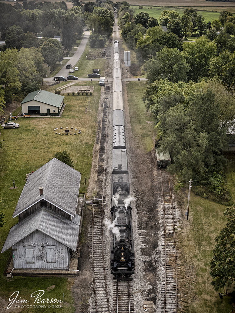 The American History Train, being led by Nickel Plate Road (NKP) steam locomotive 765, sits next to the old New York Central Depot on September 24th, 2022, at Pleasant Lake, Indiana.

NKP 765 was pulling the American History Train between Pleasant Lake from Angola, Indiana during the annual American History Days Festival. It took guests back to the 1940s for a living history experience. The passengers then got a 45-minute layover at Pleasant Lake where they visited with WWII reenactors, listened to live music and much more.

According to Wikipedia: Pleasant Lake depot is also known as the New York Central Railroad Depot and is a historic train station located at Pleasant Lake, Steuben Township, Steuben County, Indiana. It was built in 1882 by the Lake Shore and Michigan Southern Railway, and is a one-story, rectangular, Gothic Revival style frame building. It has a gable roof and is clad in board and batten siding.

It was listed on the National Register of Historic Places in 2001 as the Pleasant Lake Depot.

Nickel Plate Road 765 is a class "S-2" 2-8-4 "Berkshire" type steam locomotive built for the New York, Chicago & St. Louis Railroad, commonly referred to as the "Nickel Plate Road".

No. 765 continues to operate in mainline excursion service and is owned and maintained by the Fort Wayne Railroad Historical Society and was also added to the National Register of Historic Places on September 12, 1996.

Tech Info: DJI Mavic Air 2S Drone, 22mm, f/2.8, 1/2000, ISO 100.

#trainphotography #railroadphotography #trains #railways #dronephotography #trainphotographer #railroadphotographer #jimpearsonphotography