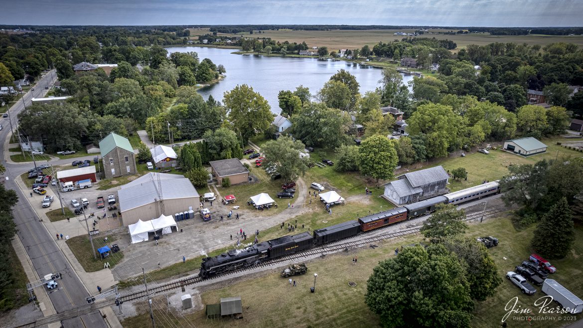 Nickel Plate Road (NKP) 765 leads the American History Train as sits in the station at Pleasant Lake, Indiana on the Indiana Northeastern Railroad on September 24th, 2022.

NKP 765 was pulling the American History Train between Pleasant Lake from Angola, Indiana during the annual American History Days Festival. It took guests back to the 1940s for a living history experience. The passengers then got a 45-minute layover at Pleasant Lake where they visited with WWII reenactors, listened to live music and much more.

According to Wikipedia: Nickel Plate Road 765 is a class "S-2" 2-8-4 "Berkshire" type steam locomotive built for the New York, Chicago & St. Louis Railroad, commonly referred to as the "Nickel Plate Road".

No. 765 continues to operate in mainline excursion service and is owned and maintained by the Fort Wayne Railroad Historical Society and was also added to the National Register of Historic Places on September 12, 1996.

Tech Info: DJI Mavic Air 2S Drone, 22mm, f/2.8, 1/1250, ISO 110.

#trainphotography #railroadphotography #trains #railways #dronephotography #trainphotographer #railroadphotographer #jimpearsonphotography #nkp765 #steamtrain