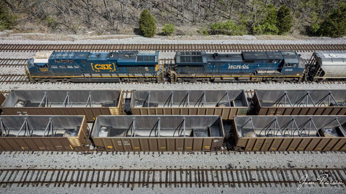 CSXT 3200 and BCRAIL 4648 lead CSX B744, a combined empty ethanol and coal train, pass through the the south end of CSX Atkinson Yard in Madisonville, Ky on April 3rd, 2023, as they head north on the Henderson Subdivision. 

According to Wikipedia: BC Rail is a railway in the Canadian province of British Columbia. Chartered as a private company in 1912 as the Pacific Great Eastern Railway, it was acquired by the provincial government in 1918. In 1972 it was renamed to the British Columbia Railway, and in 1984 it took on its present name of BC Rai and is currently owned by CN.

Tech Info: DJI Mavic 3 Classic Drone, RAW, 24mm, f/2.8, 1/1600, ISO 100.

#trainphotography #railroadphotography #trains #railways #dronephotography #trainphotographer #railroadphotographer #jimpearsonphotography #kentuckytrains #csx #csxrailway #HopkinsvilleKy #mavic3classic #drones #trainsfromtheair #trainsfromadrone #csxhendersonsubdivison
