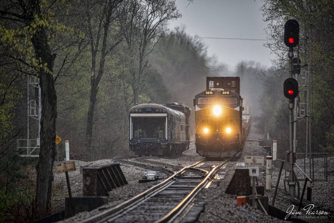 CSX Intermodal, I028, passes Geometry train CSX W001 sitting in the siding at the north end of Latham at Hopkinsville, Ky on April 5th, 2023, on the CSX Henderson Subdivision in a light rain. CSX W001 backed out onto the main after I028 passed and continued their inspection south.

Tech Info: Nikon D800, RAW, Sigma 150-600mm @ 450mm, f/2.8, 1/500, ISO 1000.

#trainphotography #railroadphotography #trains #railways #trainphotographer #railroadphotographer #jimpearsonphotography #csxhendersonsubdivision #csx #hopkinsvilleKy