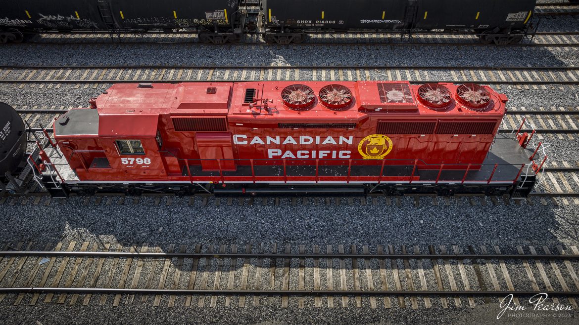 Newly painted and refurbished Canadian Pacific 5798 sits tied down in the Paducah and Louisville Railway Yard in Louisville, Kentucky on April 15th, 2023. The markings under the cab window are SD40-2 DRF-30. Not sure where it was rebuilt and what was done to it however, with the recent merger between the CP and KCS, the road name on this newly painted unit is now incorrect!

Tech Info: DJI Mavic 3 Classic Drone, RAW, 24mm, f/2.8, 1/1000 sec, ISO 130.

#trainphotography #railroadphotography #trains #railways #dronephotography #trainphotographer #railroadphotographer #jimpearsonphotography #kentuckytrains #mavic3classic #drones #trainsfromtheair #trainsfromadrone #CPRailway #Jeffersonville #CanadianPacific