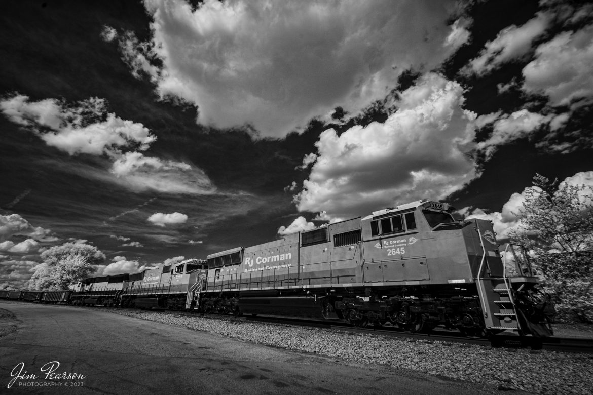 This week's Saturday Infrared photo is of newly painted and refurbished RJ Corman units 2645 and 2648, along with GMTX 9059, as they sit at Nugent Sand Yard in Louisville, Ky on Saturday afternoon, April 15th, 2023. These first two units were recently acquired by the company from Norfolk Southern and are SD70M locomotives, which are beginning to see road service after coming out of the shops.

Tech Info: Fuji XT-1, RAW, Converted to 720nm B&W IR, Nikon 10-24 @10mm, f/9, 1/250, ISO 400.

#trainphotography #railroadphotography #trains #railways #jimpearsonphotography #infraredtrainphotography #infraredphotography #trainphotographer #railroadphotographer #RJCrailroad #RJCorman #LouisvilleKy