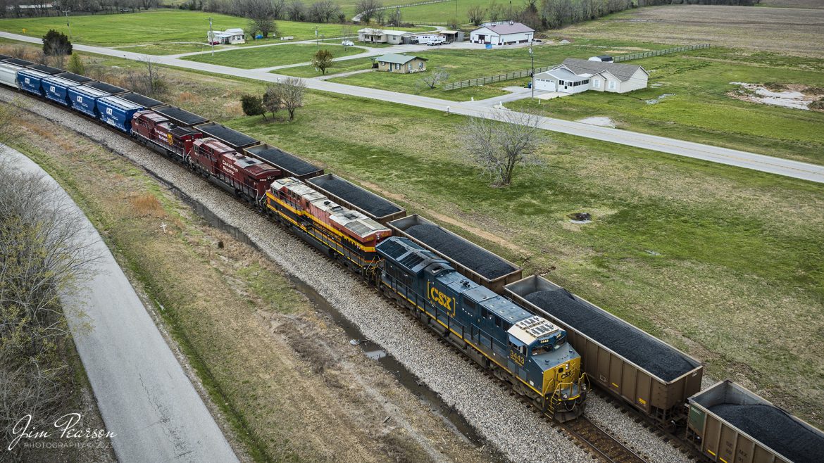 CSX B244, an empty potash train waits in the siding at the north end of Kelly, Kentucky on the CSX Henderson Subdivision, on March 31st, 2023, as loaded coal train passes him on the main headed south. CSX B244 is a fairly new, as-needed potash train off the CP that runs between Chicago, IL and Tampa, FL. The power on this move is CSX 3443, KCS 4728, CP 8933 and CP 8021.

Tech Info: DJI Mavic 3 Classic Drone, RAW, 24mm, f/2.8, 1/1000, ISO 140.

#trainphotography #railroadphotography #trains #railways #dronephotography #trainphotographer #railroadphotographer #jimpearsonphotography #kentuckytrains #csx #csxrailway #KellyKy #mavic3classic #drones #trainsfromtheair #trainsfromadrone #csxhendersonsubdivison