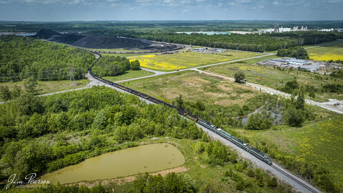 A string of Paducah and Louisville locomotives, with one Evansville Western Railway unit, pulls a long string of empty coal cars out of the loop at the Calvert City Terminal as they prepare to head south to Paducah, Kentucky on May 8th, 2023.

Tech Info: DJI Mavic 3 Classic Drone, RAW, 24mm, f/2.8, 1/1250, ISO 100.

#trainphotography #railroadphotography #trains #railways #dronephotography #trainphotographer #railroadphotographer #jimpearsonphotography #PALtrains #mavic3classic #drones #trainsfromtheair #trainsfromadrone #pal #CCT #emptycoaltrain #calvertcityterminal #kentuckytrains