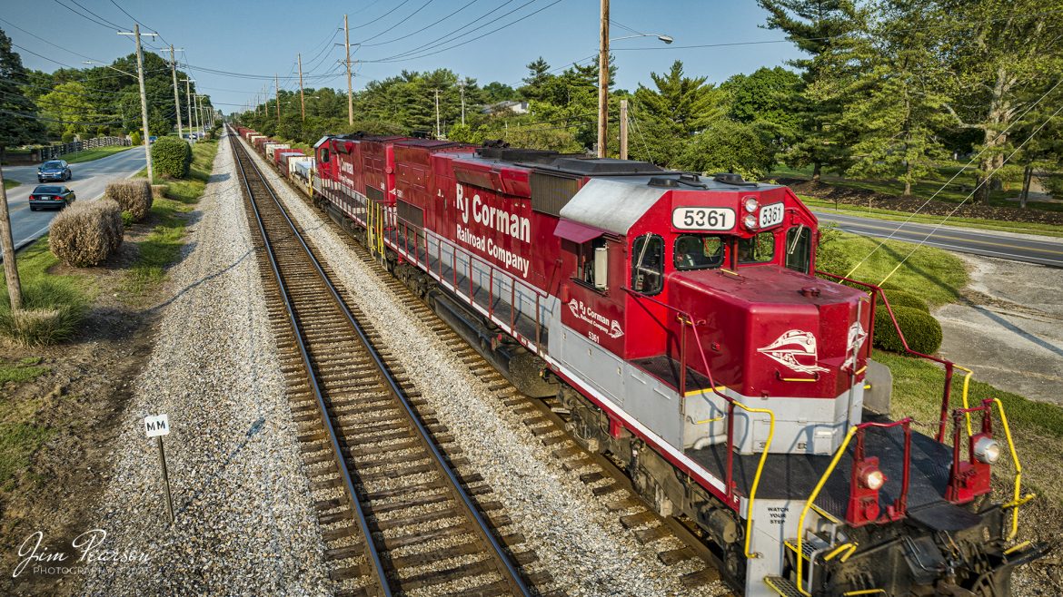 RJ Corman 5361 leads Z545, a train loaded with aluminum ingots towards Louisville, Ky on the CSX LCL Subdivision on May 18th, 2023. This train is also referred to as the ALCAN train and it runs daily between Louisville and Berea, Ky, to and from the Novelis Recycling center at Berea. Alcan used to own the Company and the name most folks use for this train is still Alcan even though Novelis bought them out. 

The Berea plant is one of the worlds largest plants dedicated to aluminum can recycling, and they process approximately 20 percent of the United States used aluminum cans, by melting them down and producing sheet ingots, according to the Novelis website.

Tech Info: DJI Mavic 3 Classic Drone, RAW, 24mm, f/2.8, 1/800, ISO 100.

#trainphotography #railroadphotography #trains #railways #dronephotography #trainphotographer #railroadphotographer #jimpearsonphotography #CSXtrains #mavic3classic #drones #trainsfromtheair #trainsfromadrone #RJCtrain #RJCorman